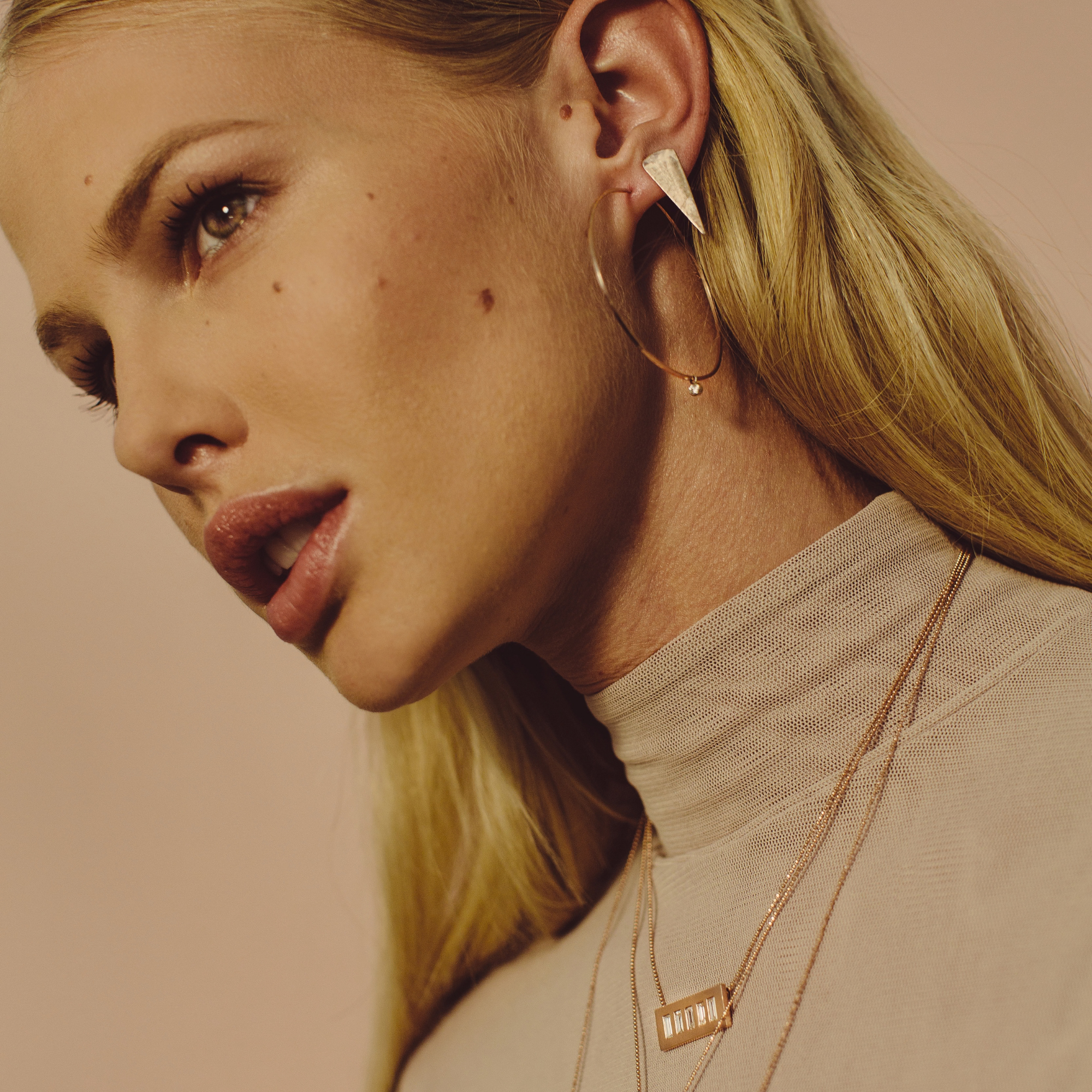 14k yellow gold ORMS medium with diamond BEZI charms on model