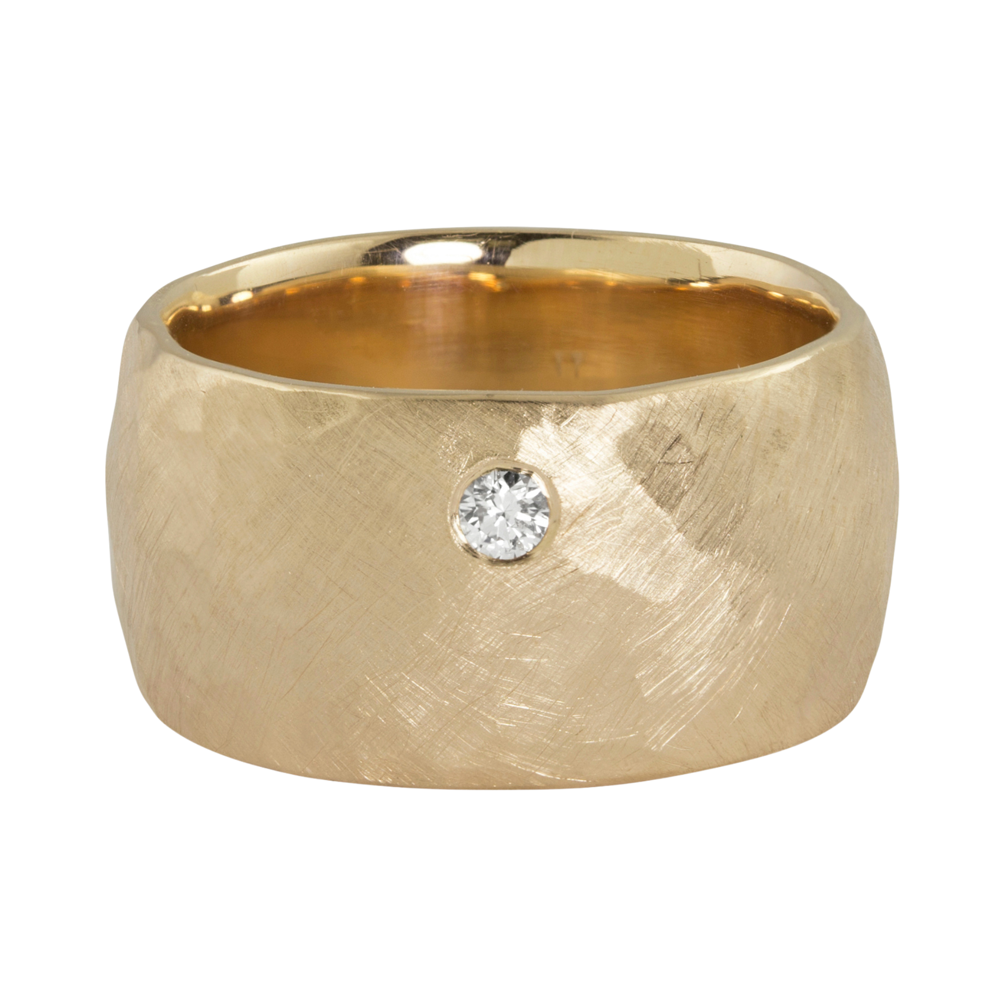 14k yellow gold wide puff comfort ring with a single offset white diamond on a white background