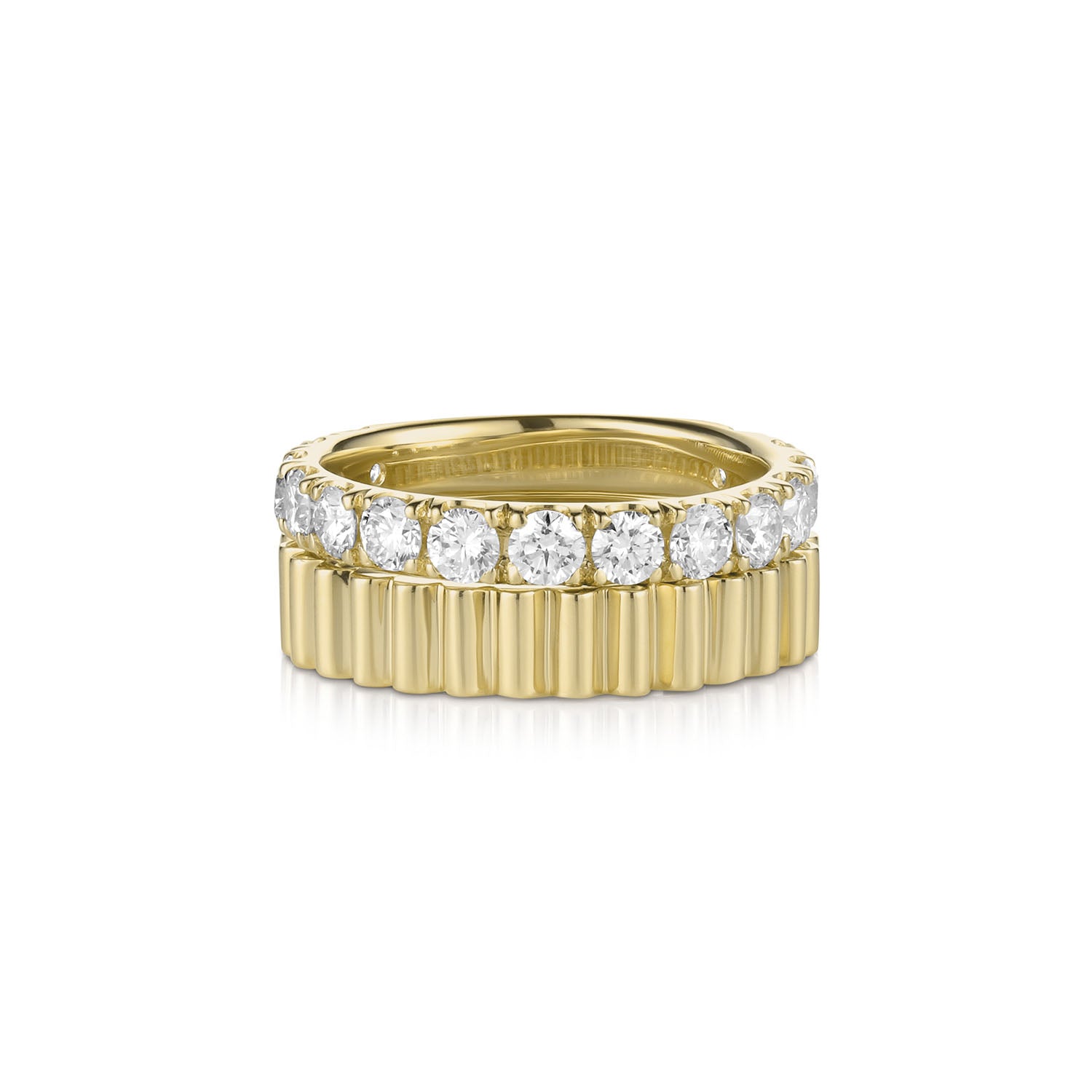 14k yellow gold ring stack with wide band geometric and eternity band embedded with diamonds on a white background