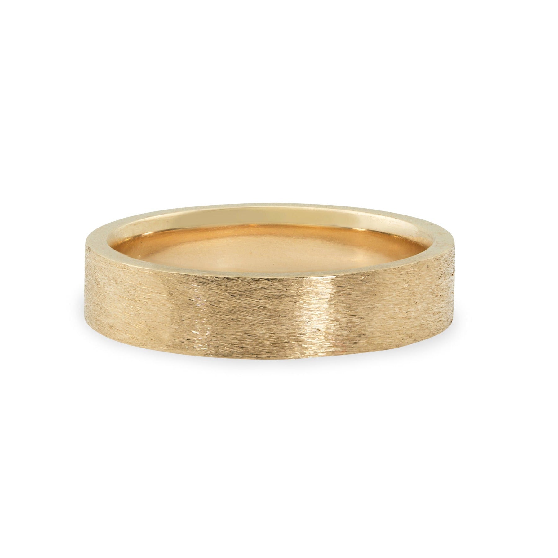 14k yellow gold wide band ring with rugged brushed texture squared edges and comfort fit interior shown laying on side on white background