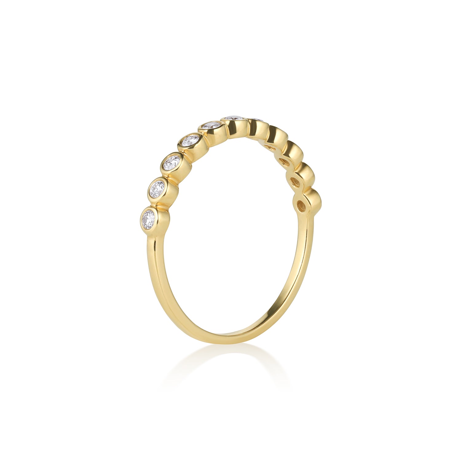 Gold ring with embedded round white diamonds, half eternity ring on a white background