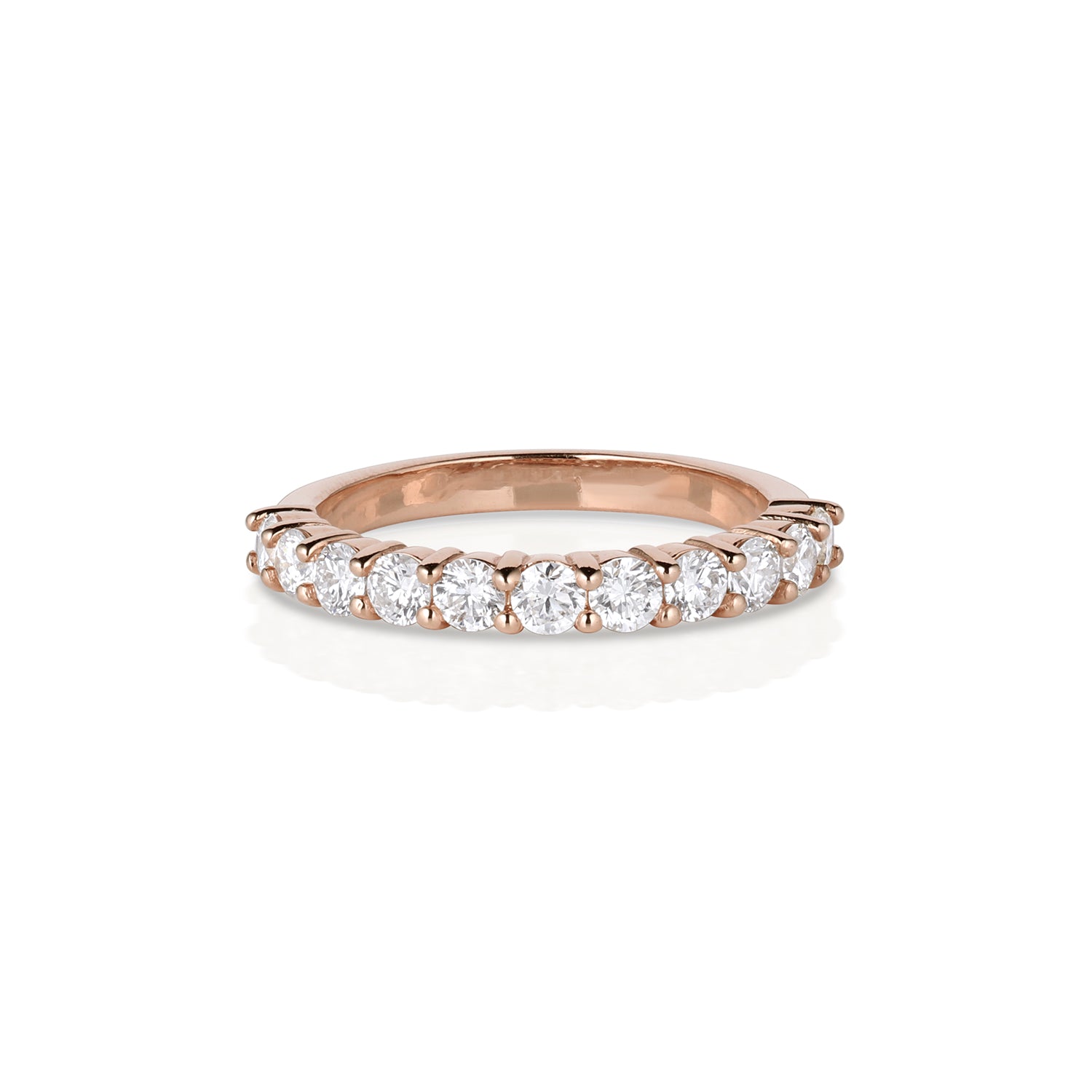 14k rose gold prong set small round white diamond half eternity wedding band on white background