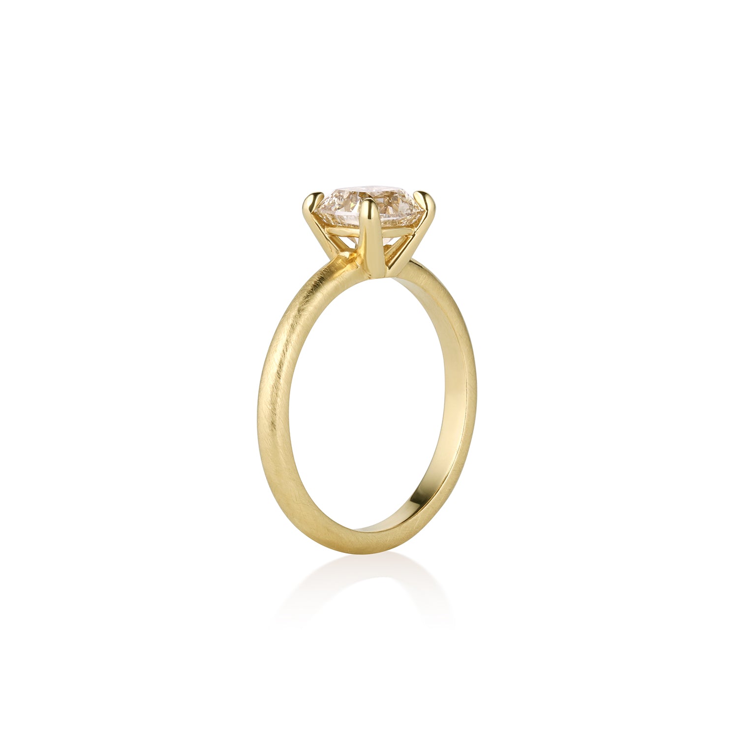 Satin finish 14k Gold ring with a square diamond basket prong side viewon a white background