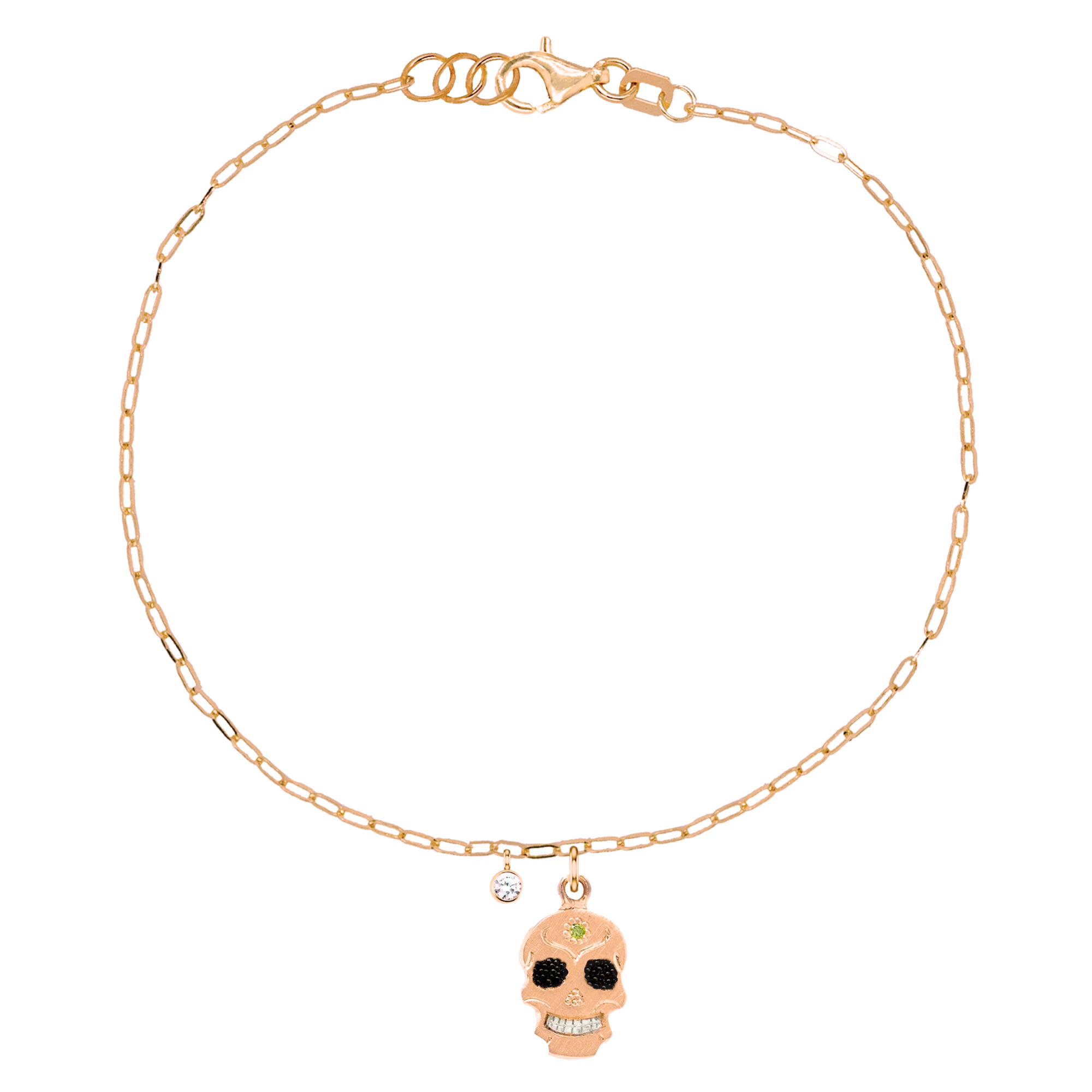 14k rose gold teeny tiny ghostrider skull charm bracelet with colored gemstone and hand etching on paperclip link chain with white diamond bezi charm on white background