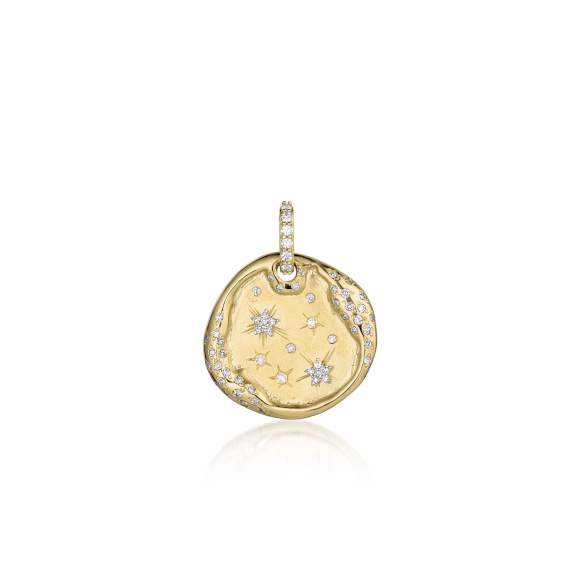 14k Gold pendant organic round shape dog tag scattered with white diamond accents, pave bale and hand engraved stars on a white background.