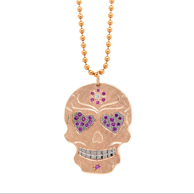 14k solid rose gold mixed diamond and sapphires. Fine detail engraving highlights features. Rhodium brightened eyes and teeth with pink sapphire pave set heart gemstone eyes. pink sapphire flower with white diamond milgrain details. Shown on 2.0mm ball chain.