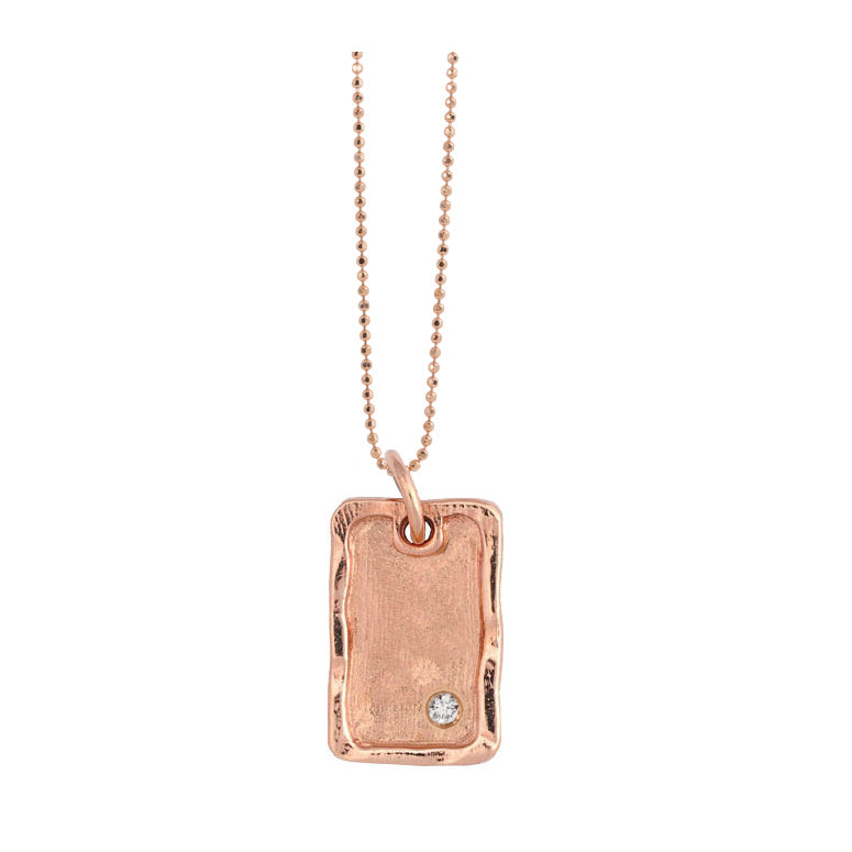 14k rose gold small DANA dog tag charm with one diamond