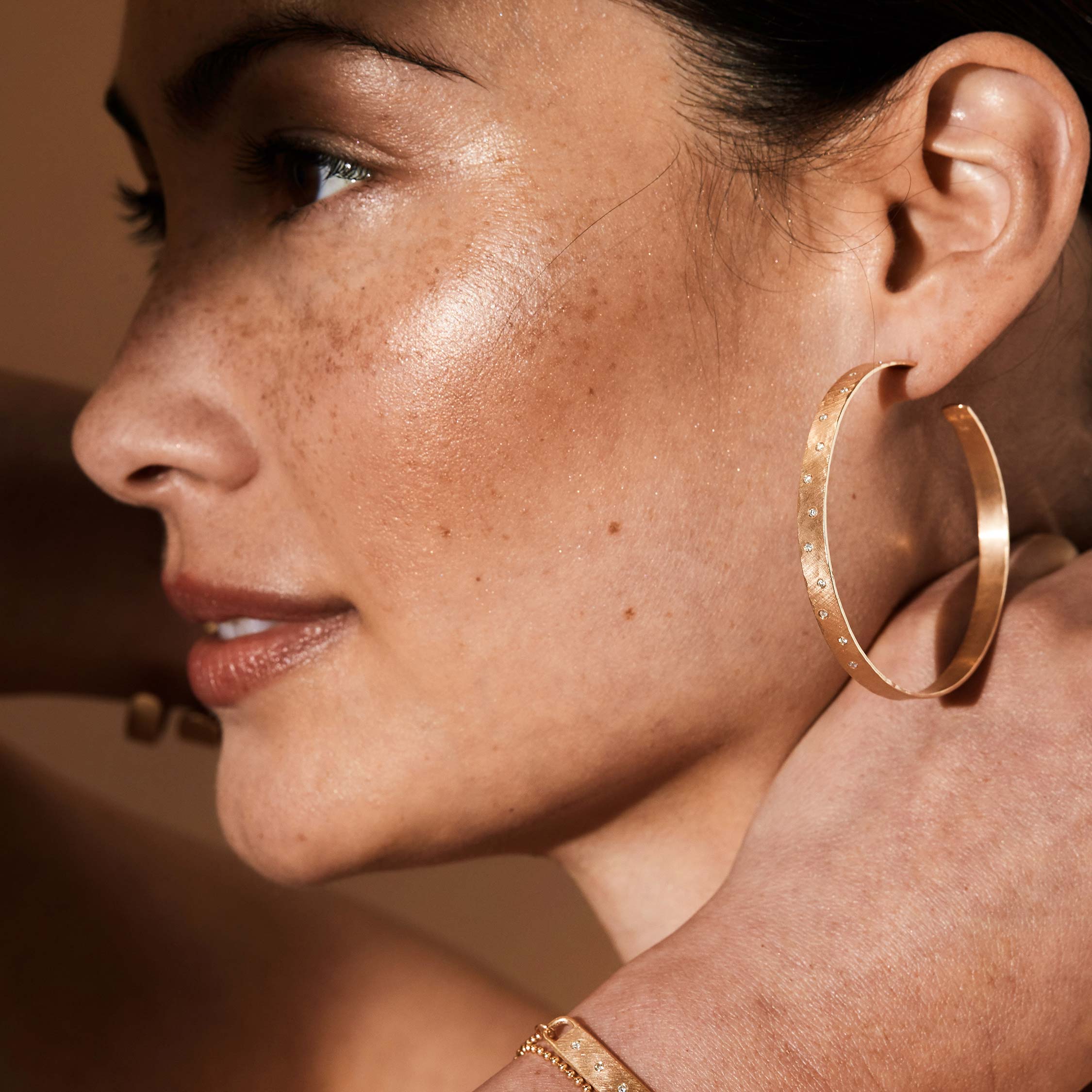 14k rose gold large OPAR wide hoop earrings on model