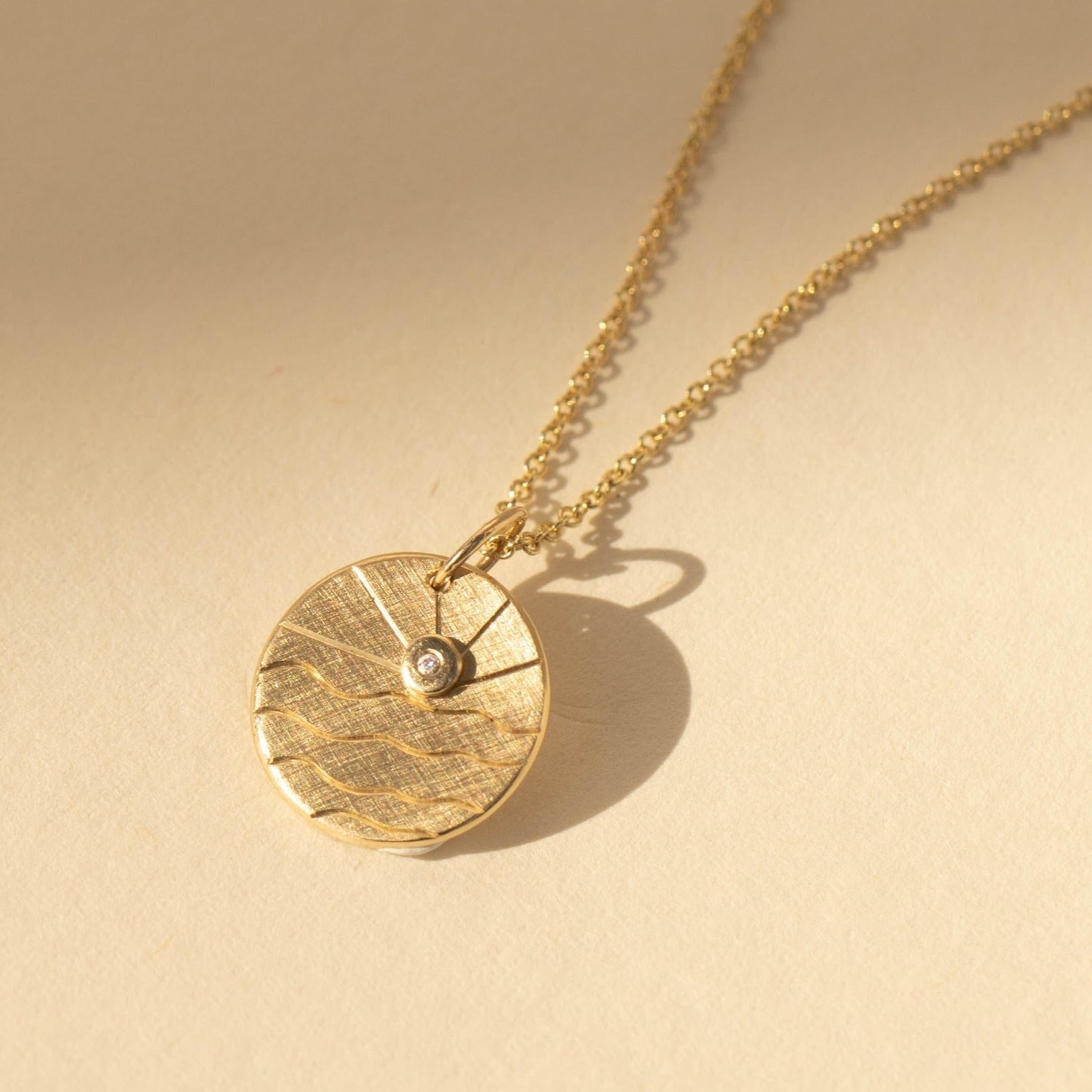 14k gold GOOS charm with hand etching in studio