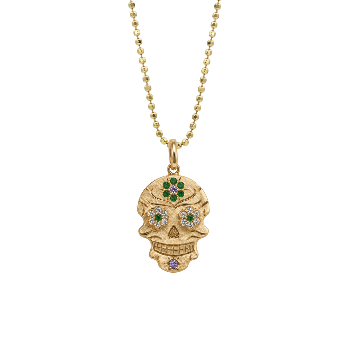 14k gold skor with white diamonds and green sapphires on white background
