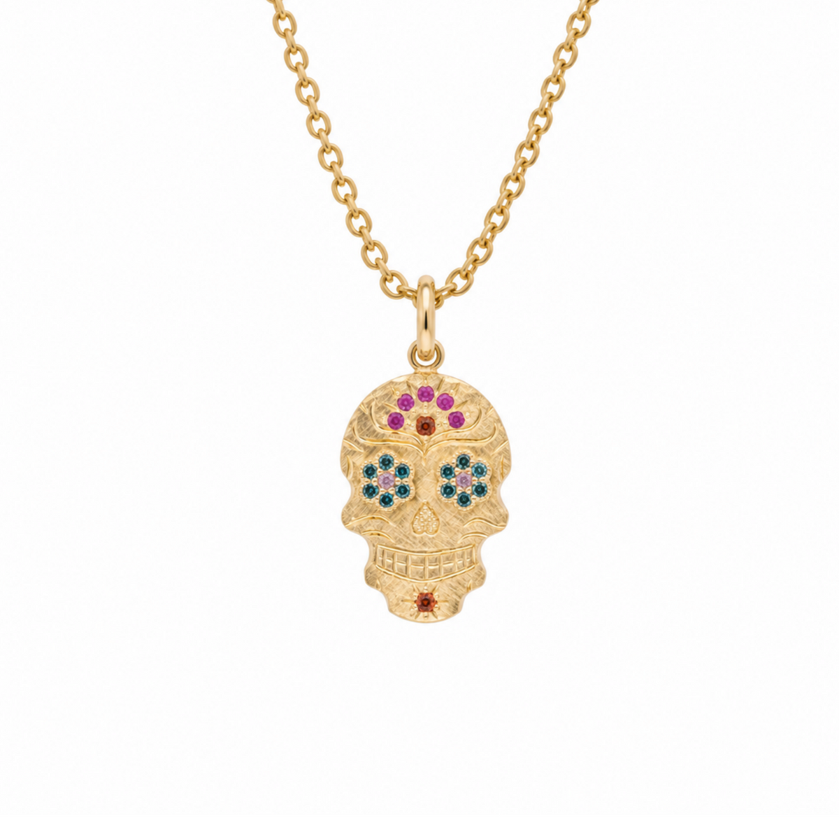 14k gold sugar skull with sapphire arch on white background