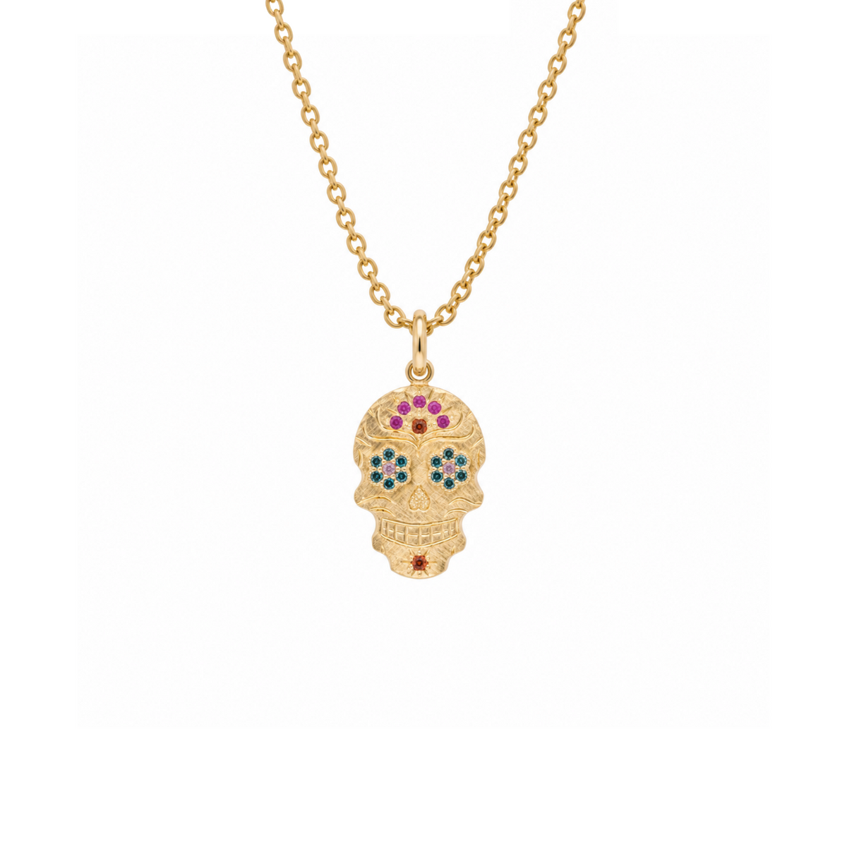 14k gold sugar skull with sapphire arch on white background