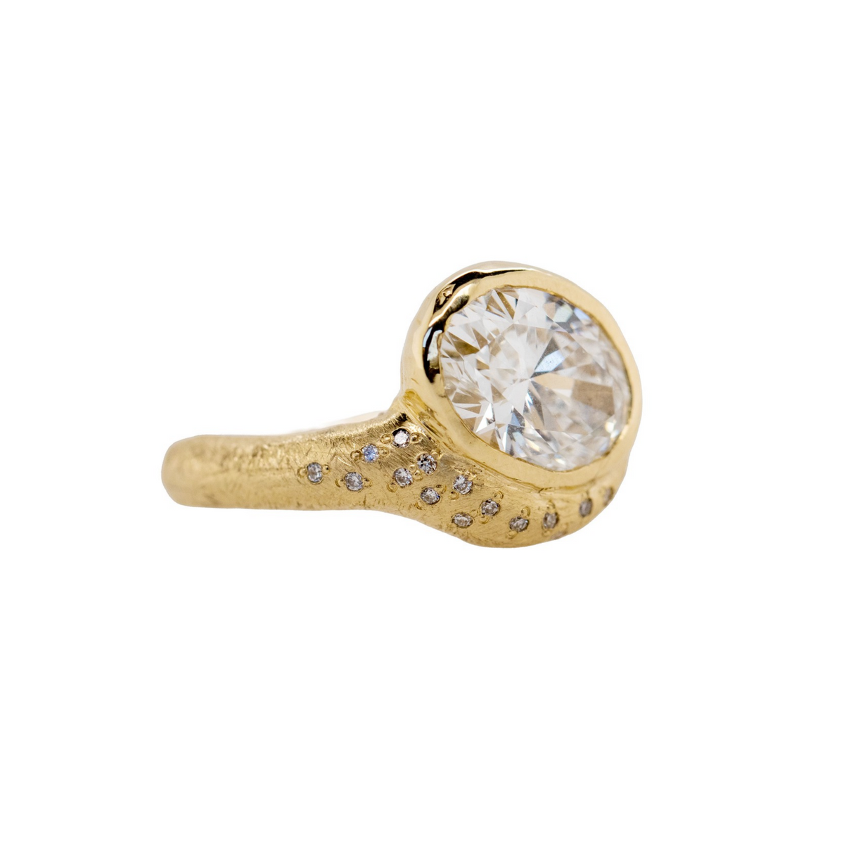 14k gold round engagement ring with organic band with scattered white diamonds on white background