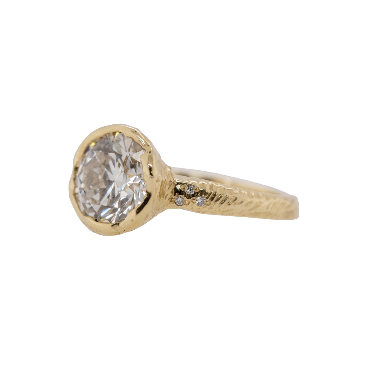 14k gold organic bezel set diamond engagement ring on white background