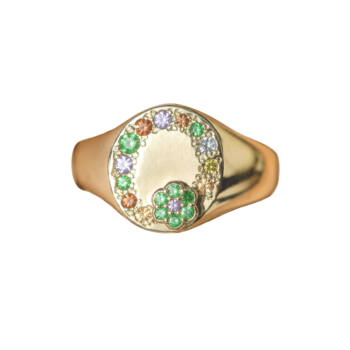 14k gold signet ring with colored sapphires and raised flower on white background