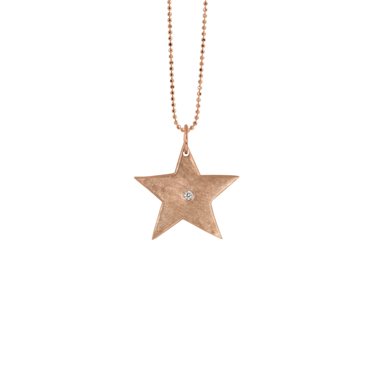 14k gold star pendant with single white diamond on white background