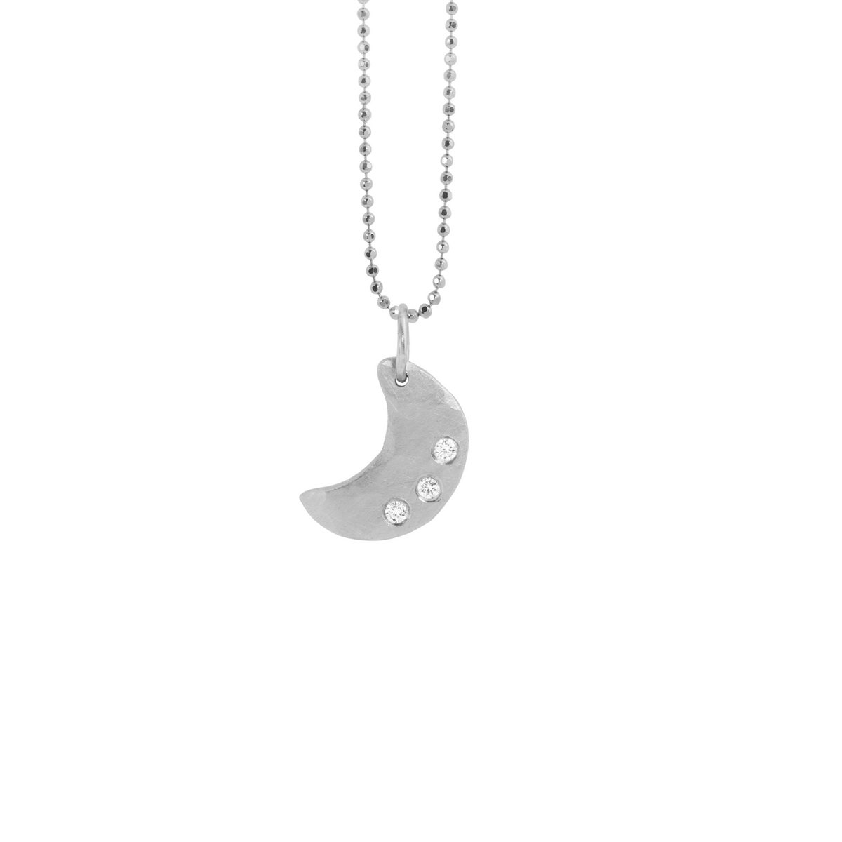 14k white gold moon pendant with three white diamonds on a white background