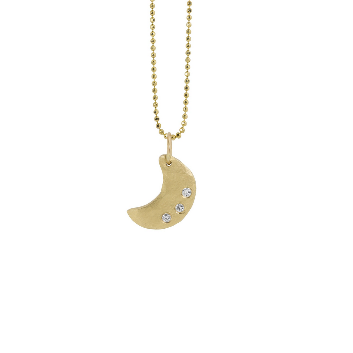 14k yellow gold moon pendant with three white diamonds on a white background