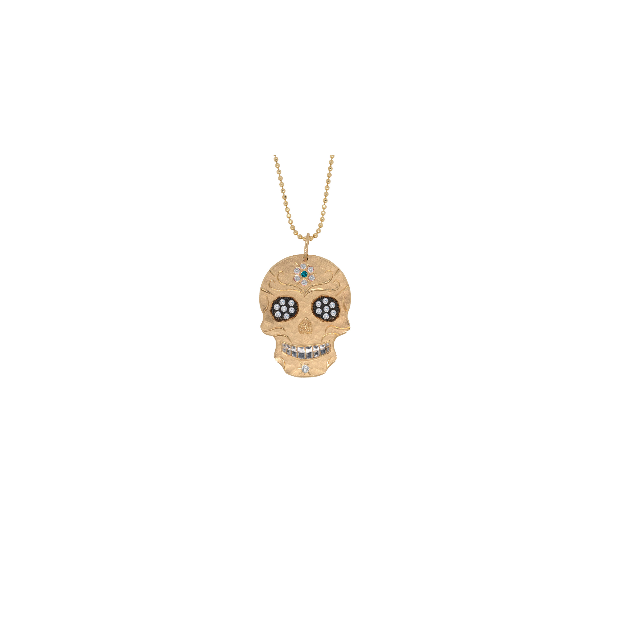 Skull-shaped pendant necklace on a white background by Julez Bryant