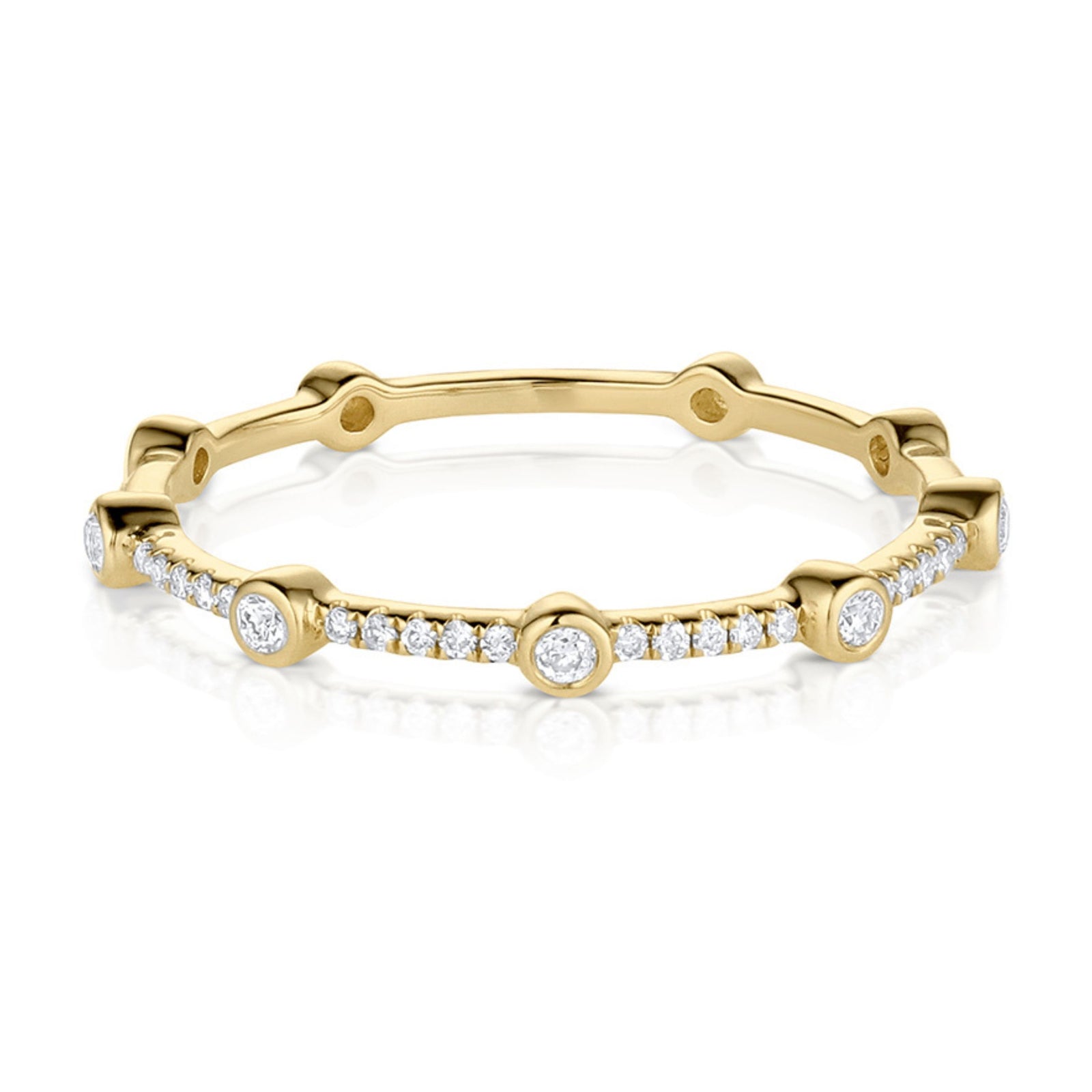 A delicate 14k gold white diamond ring with multiple small diamonds set along its circumference.