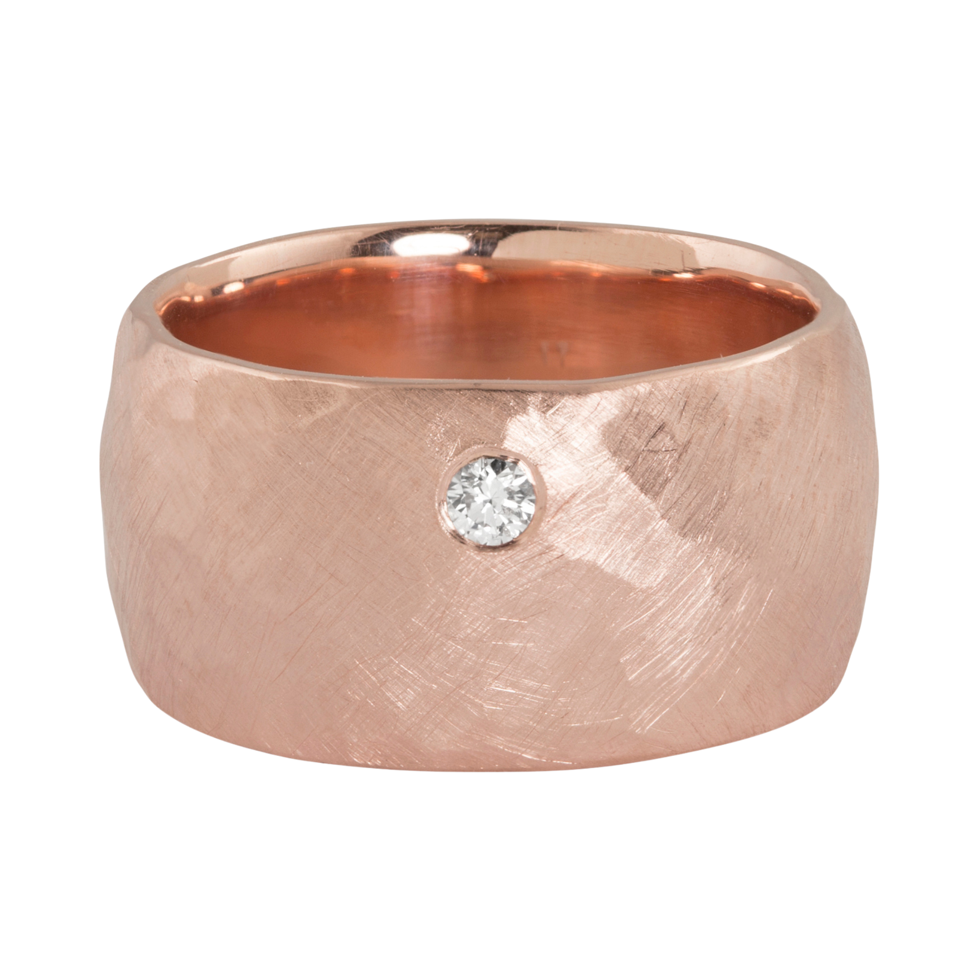 14k rose gold wide puff comfort ring with a single offset white diamond on a white background