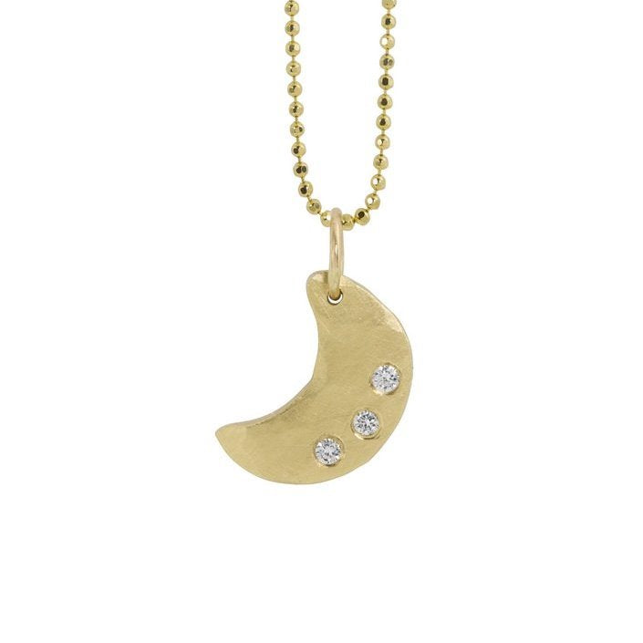 14k yellow gold necklace with a hammered crescent moon pendant featuring three small white diamonds hanging from diamond cut ball chain on a white background