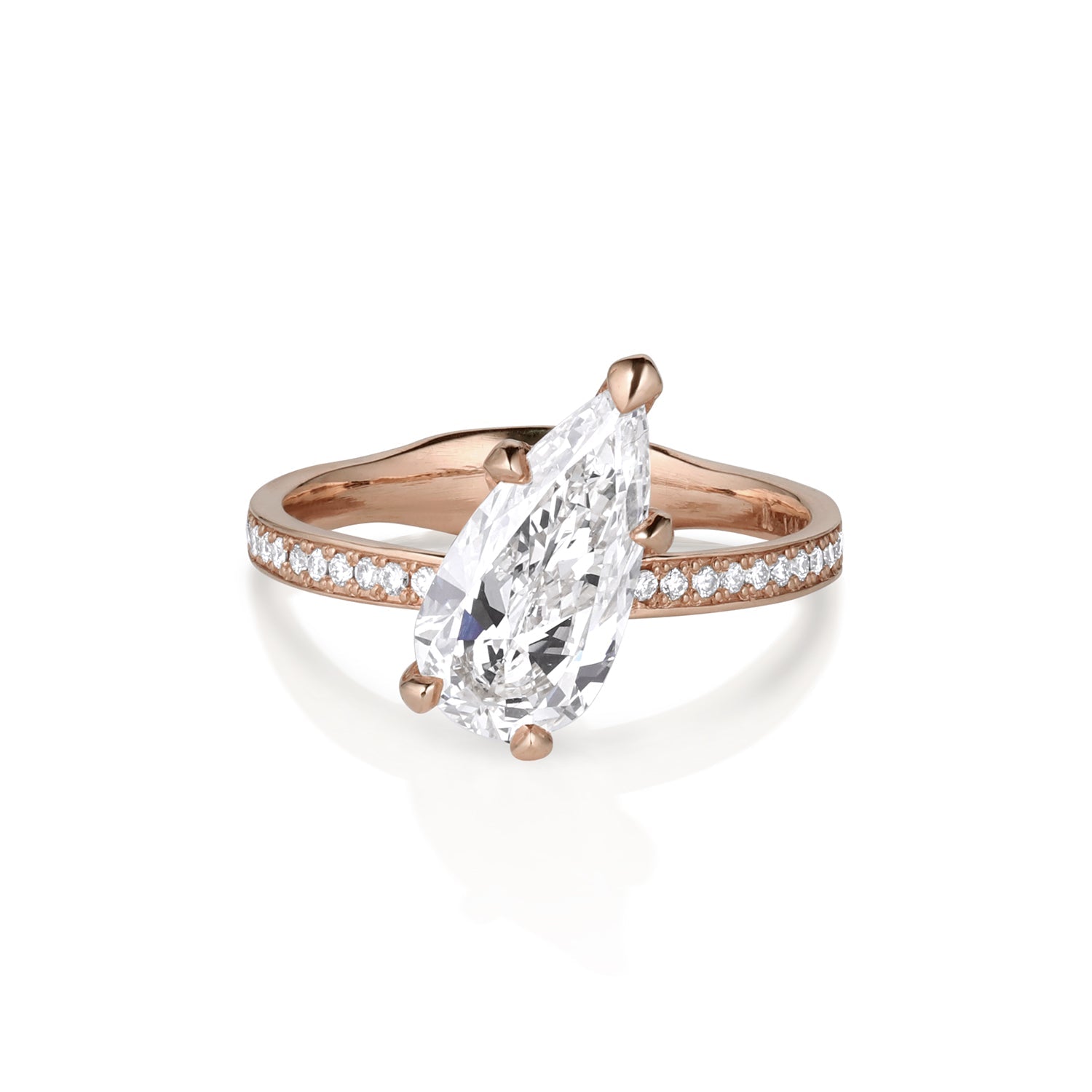 14k rose gold ring featuring a tilted pear-shaped white diamond with five prongs and a half eternity band with pave set white diamonds and a thick comfort fit band on white background