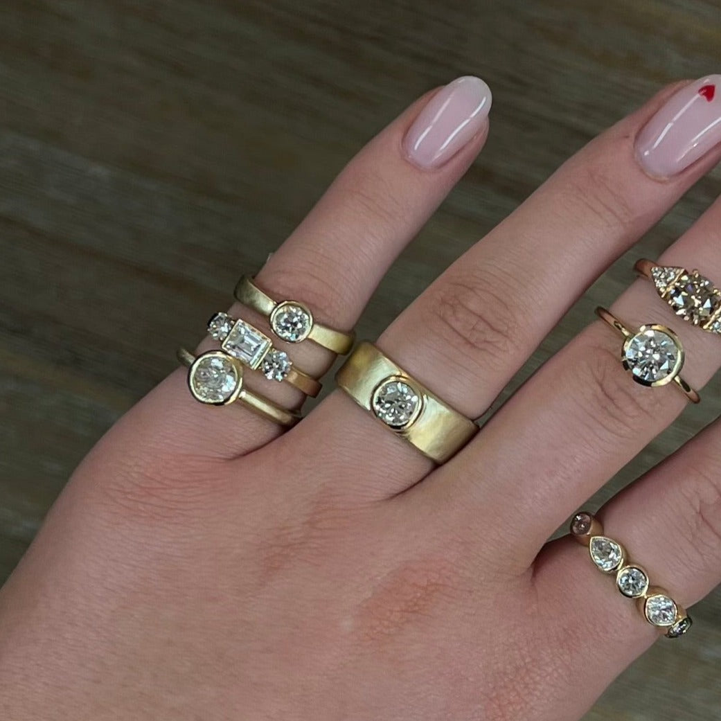 14k Yellow Gold Princess Cut Three Stone Diamond Engagement Ring on model in lifestyle shot