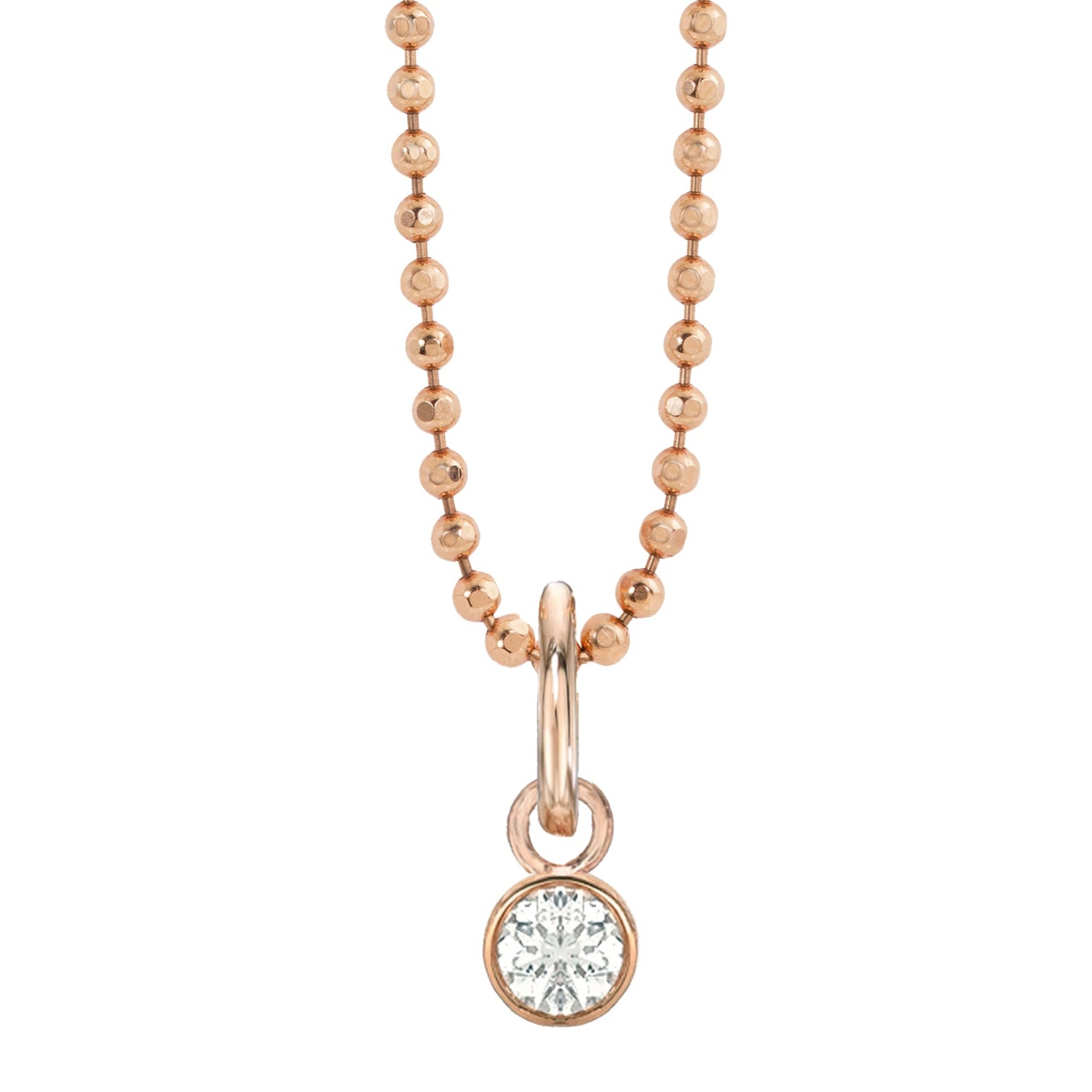 14k rose gold bezel set white diamond charm on diamond cut ball chain on white background