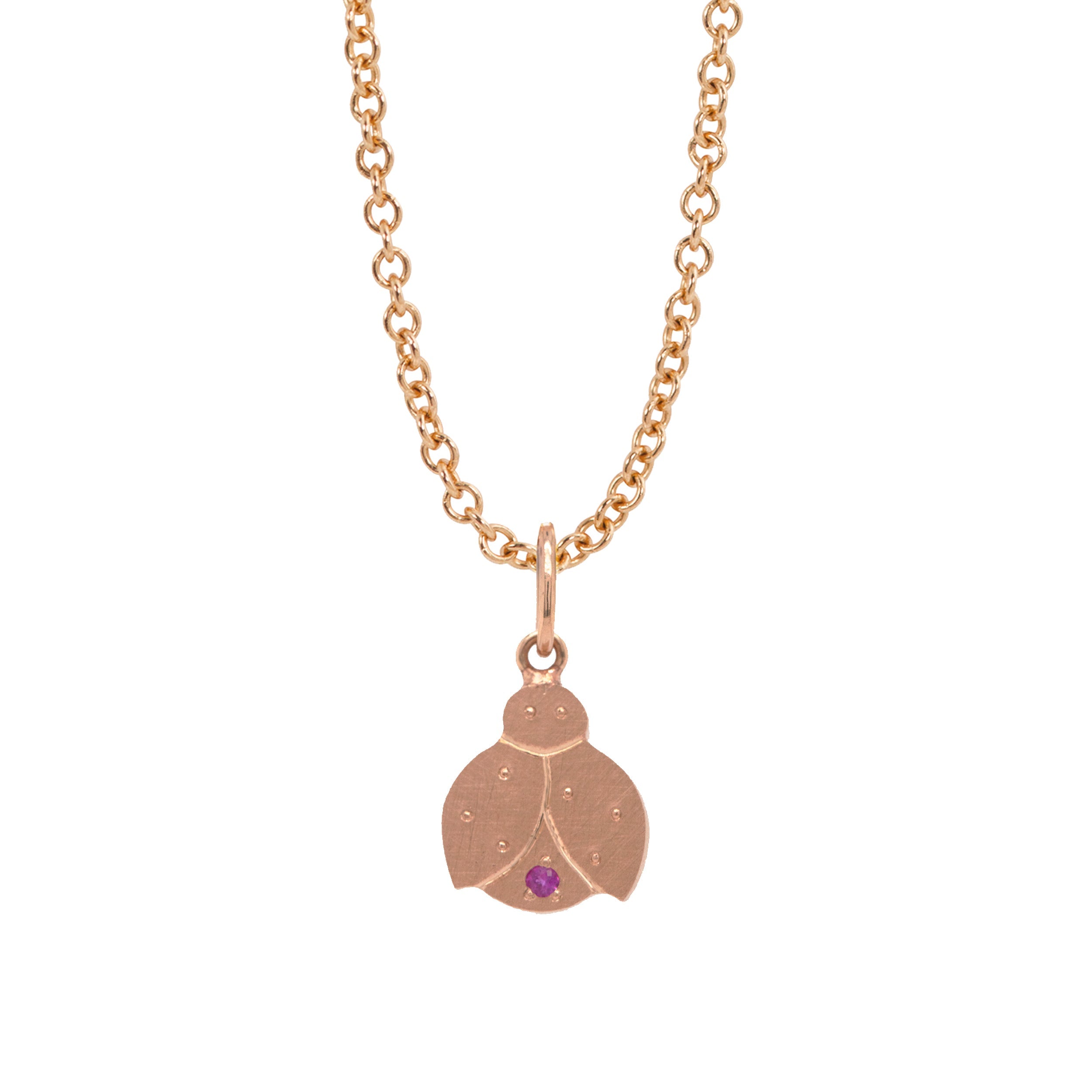 14k rose gold ladybug charm with pink sapphire accent on rolo chain on white background