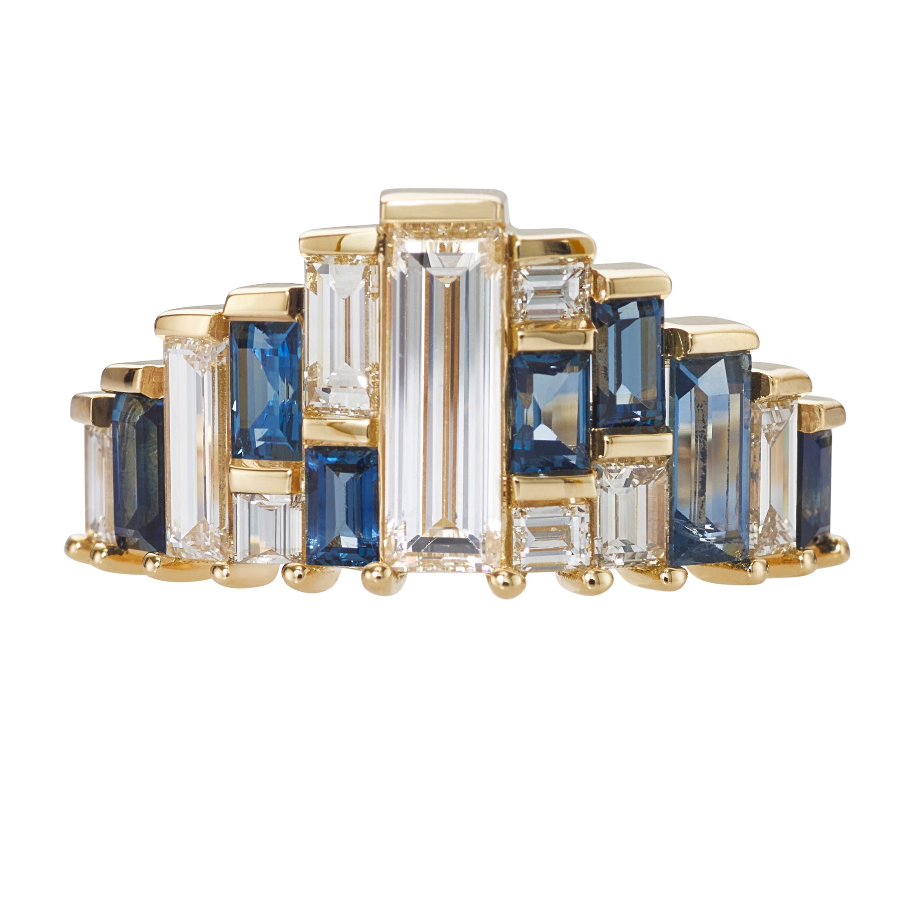 Gold ring with blue and clear gemstones on a white background