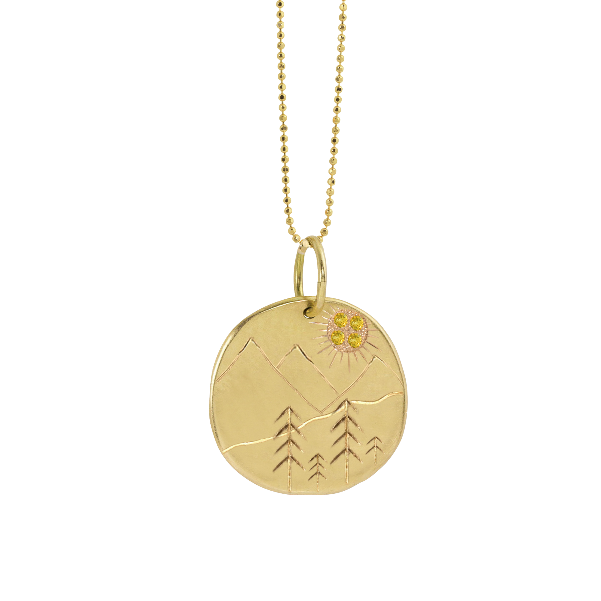 14k yellow gold round disc medallion with hand etched mountains and trees with yellow sapphire sun burst on diamond cut ball chain on white background