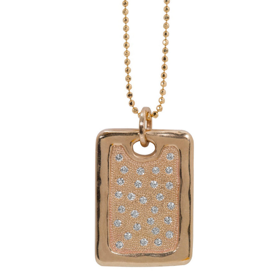 Large 14k rose gold rectangular dog tag pendant featuring high polished edge and scattered bead set white diamonds shown on diamond cut ball chain with white background 