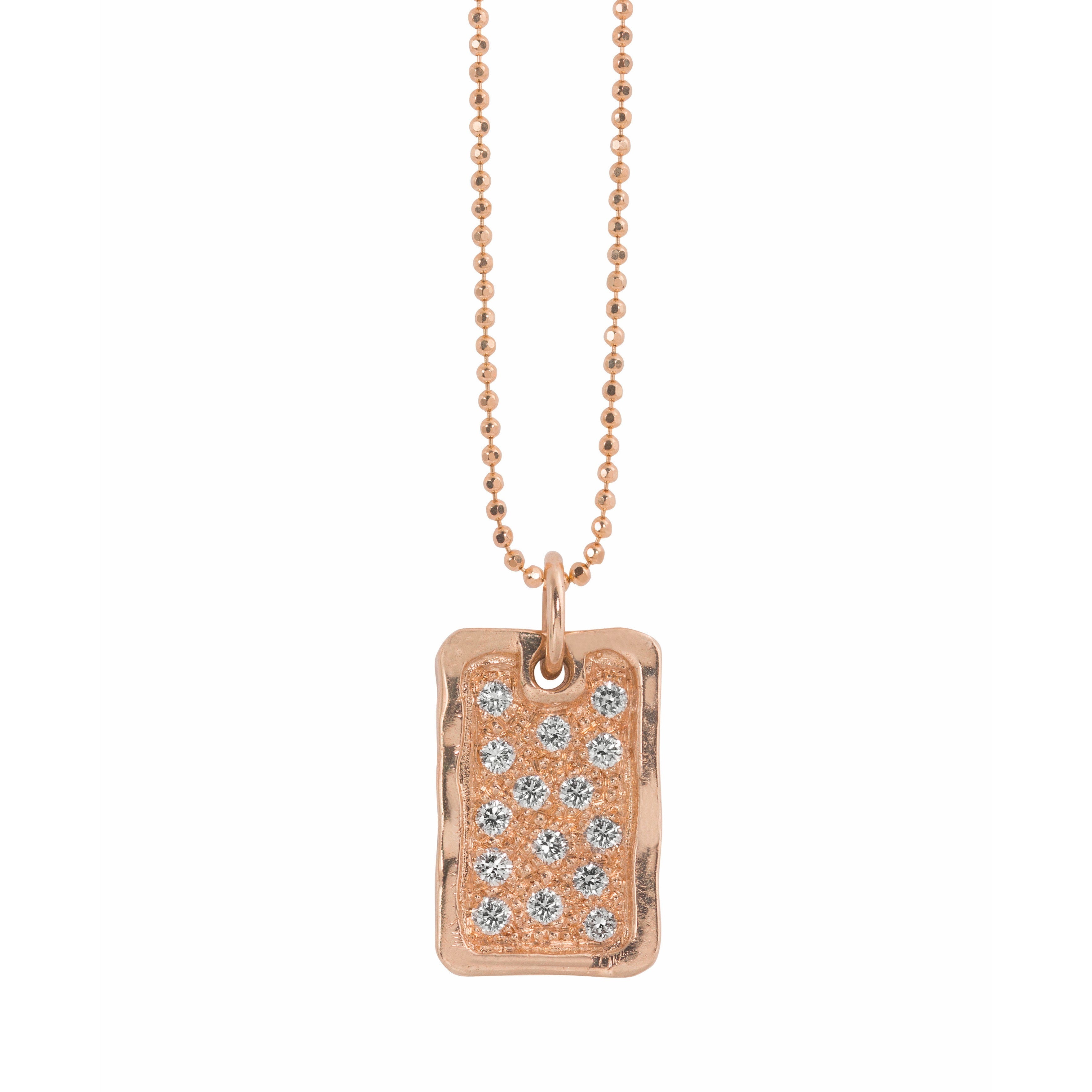 14k rose gold rectangular dog tag with beaded finish and scattered white diamonds wavy polished border hanging on ball chain shown on white background