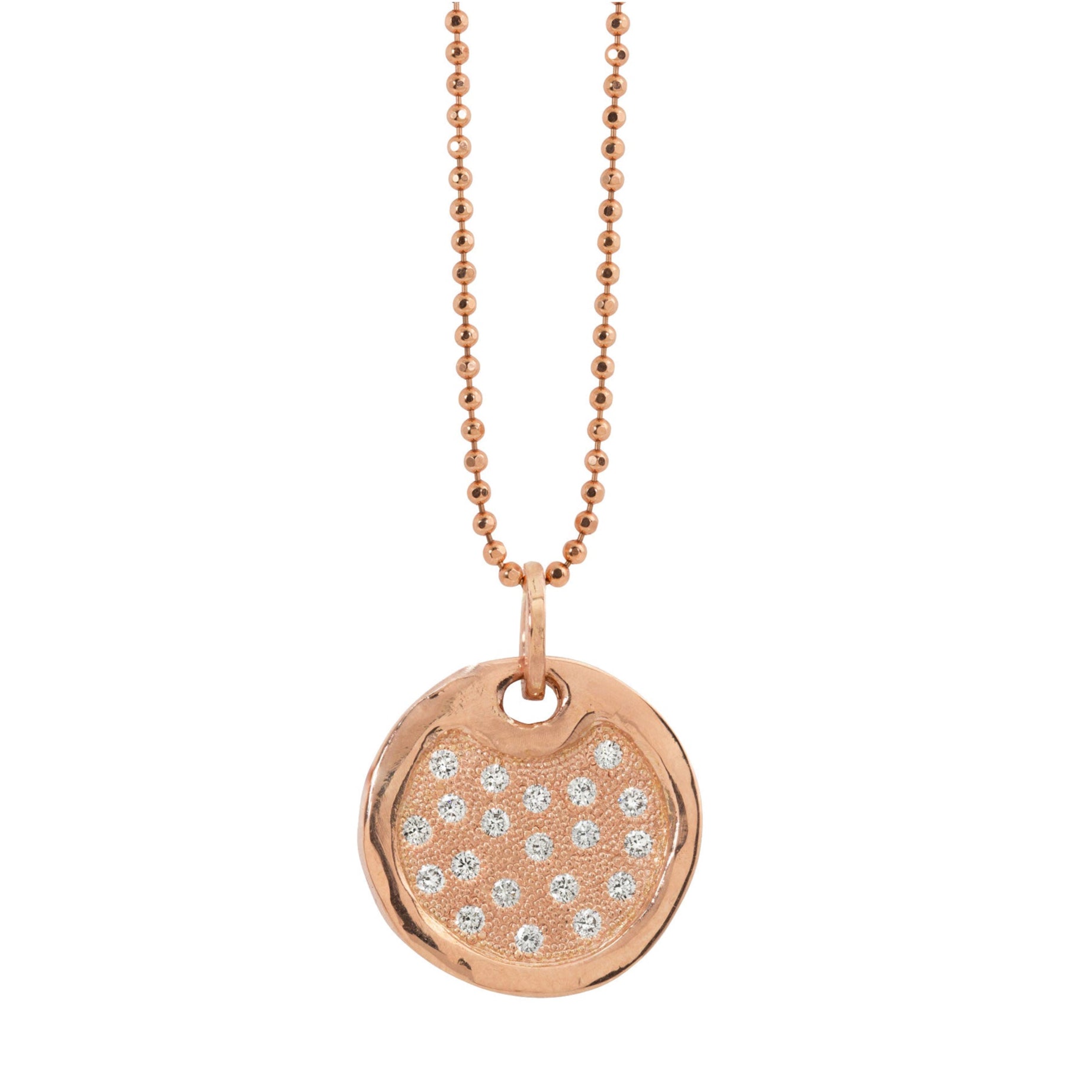 14k rose gold round dog tag necklace featuring scattered white bead set diamonds shiny polished border hanging from ball chain  on a white background