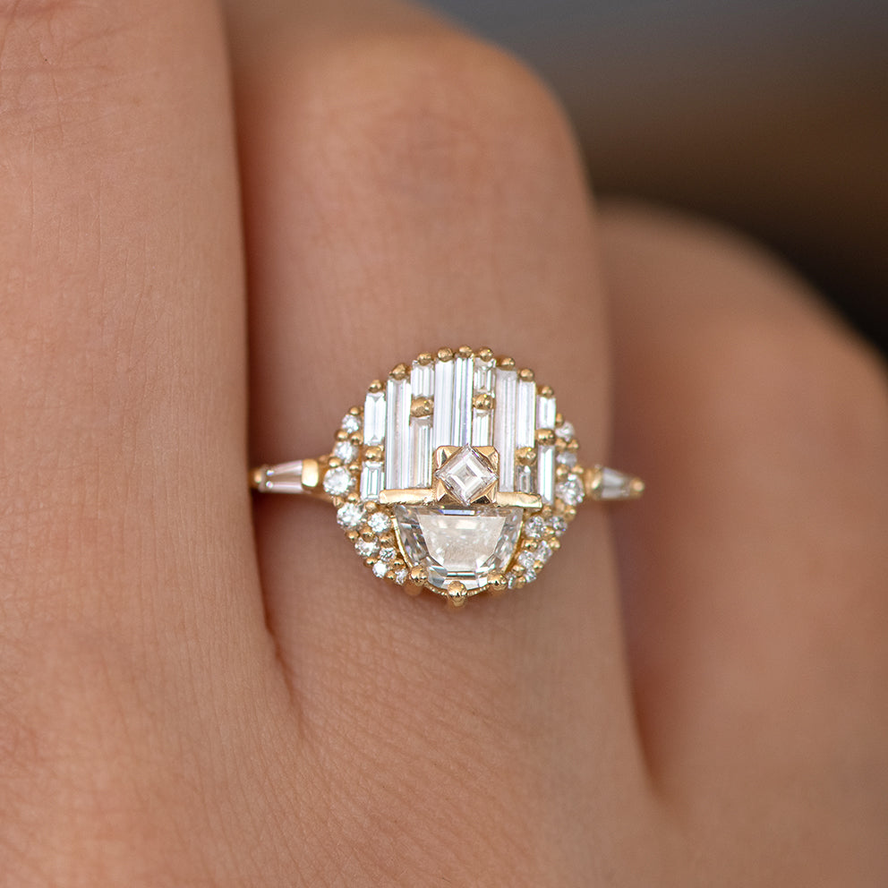 Gold ring with a diamond on a finger