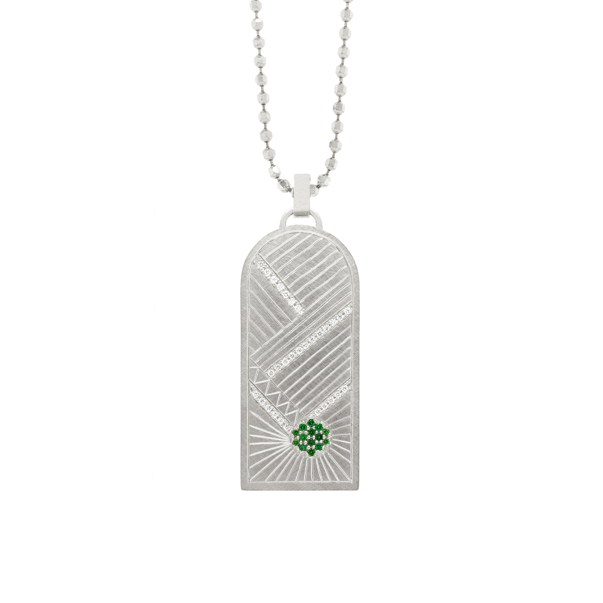 14k white gold pendant featuring hand etching with green gemstone sunburst and white diamonds on a diamond cut ball chain on white background