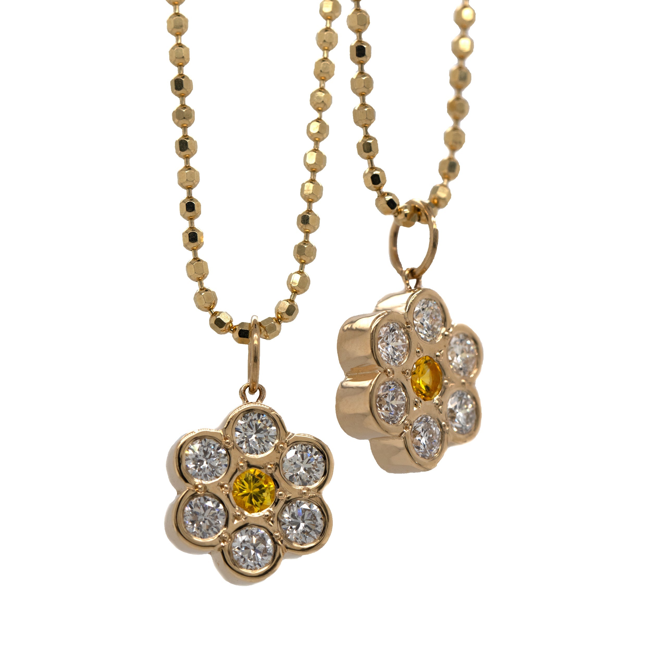 14k yellow Gold flower-shaped pendant featuring a yellow gemstone and white diamonds on a diamond cut ball chain on a white background