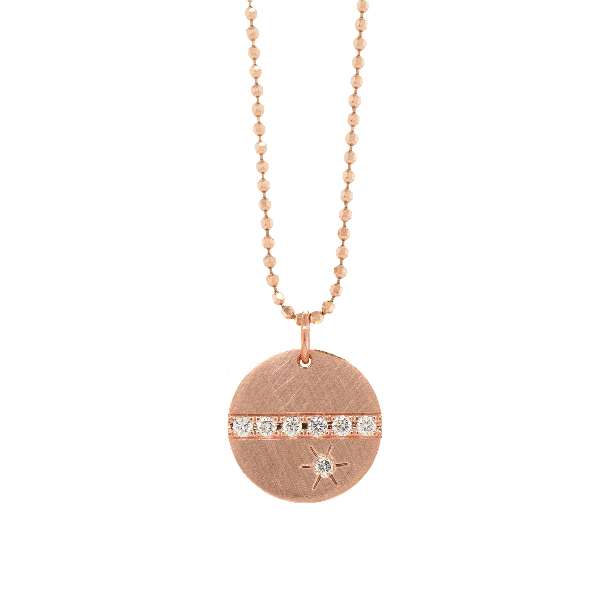 14k rose gold round pendant featuring a line of white diamonds and a white diamond sunburst on diamond cut ball chain on a white background