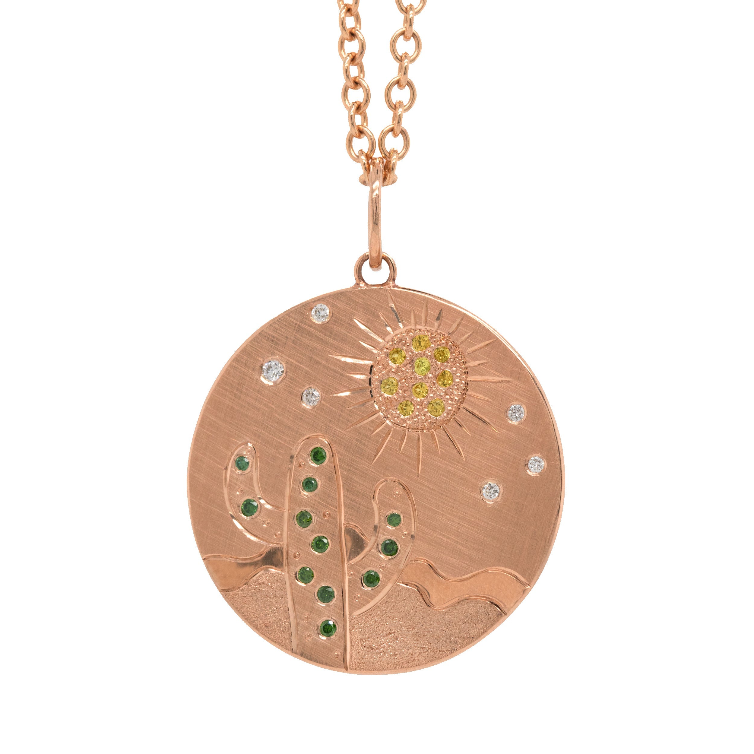 14k rose gold round pendant featuring a hand etched cactus and sun design with colored sapphires and white diamonds on a rolo chain on a white background