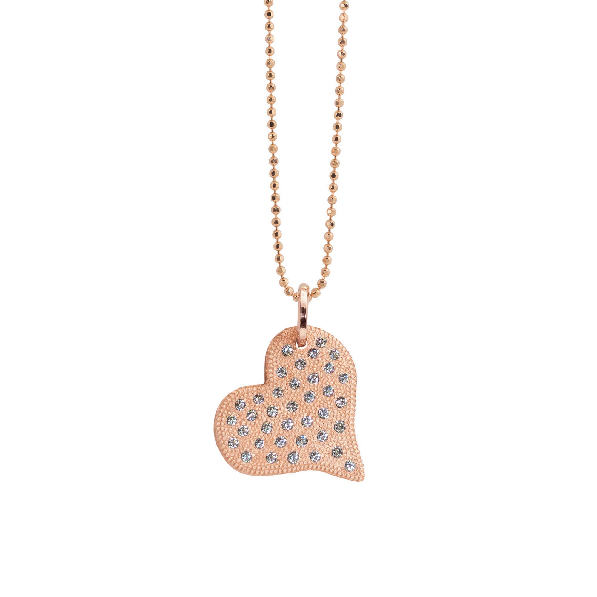 14k rose gold heart pendant with beaded texture and scattered white diamonds on a diamond cut ball chain on a white background