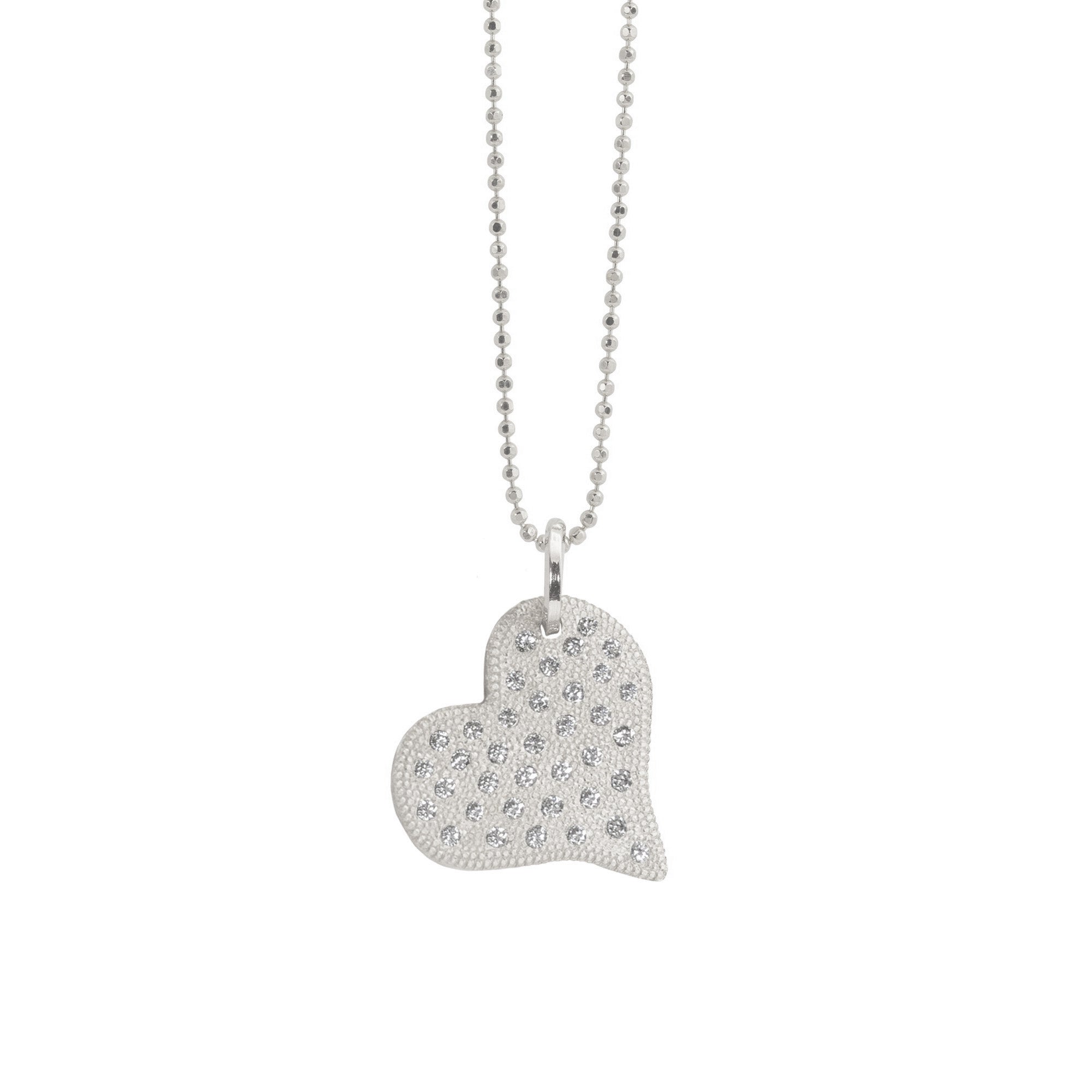 14k white gold heart pendant with beaded texture and scattered white diamonds on a diamond cut ball chain on a white background