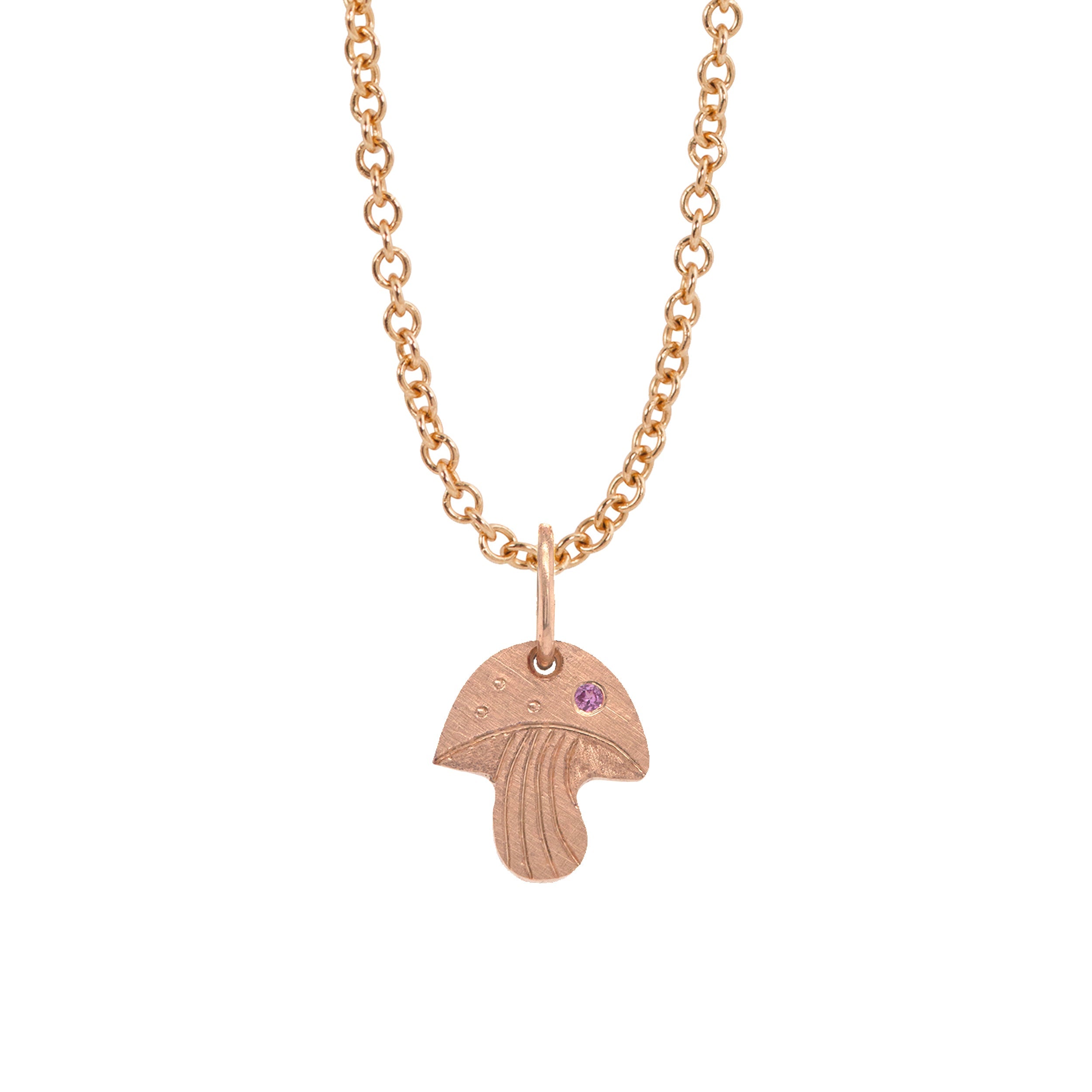 14k rose gold mushroom pendant with pink sapphire and hand etching on a rolo chain on a white background