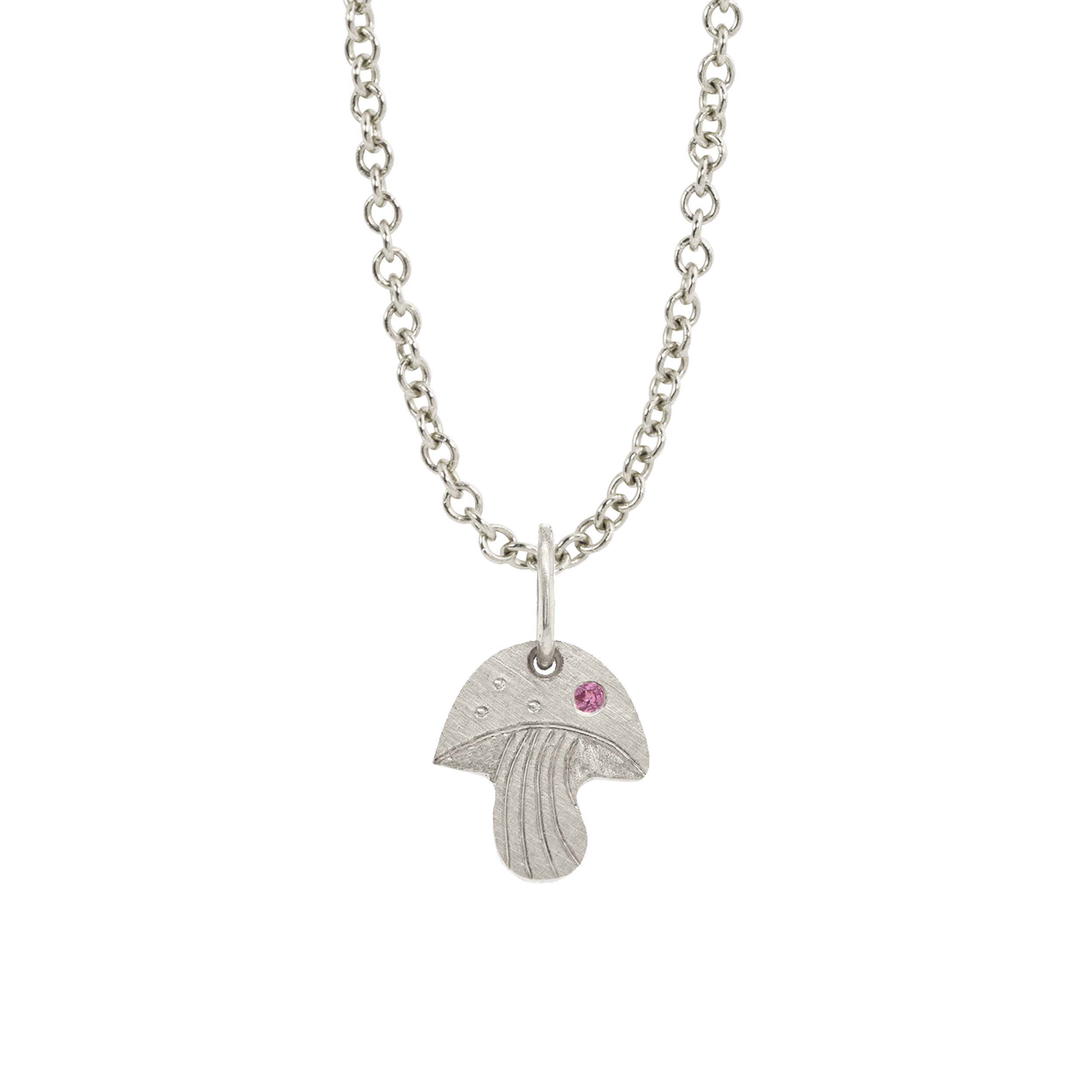 14k white gold mushroom pendant with pink sapphire and hand etching on a rolo chain on a white background