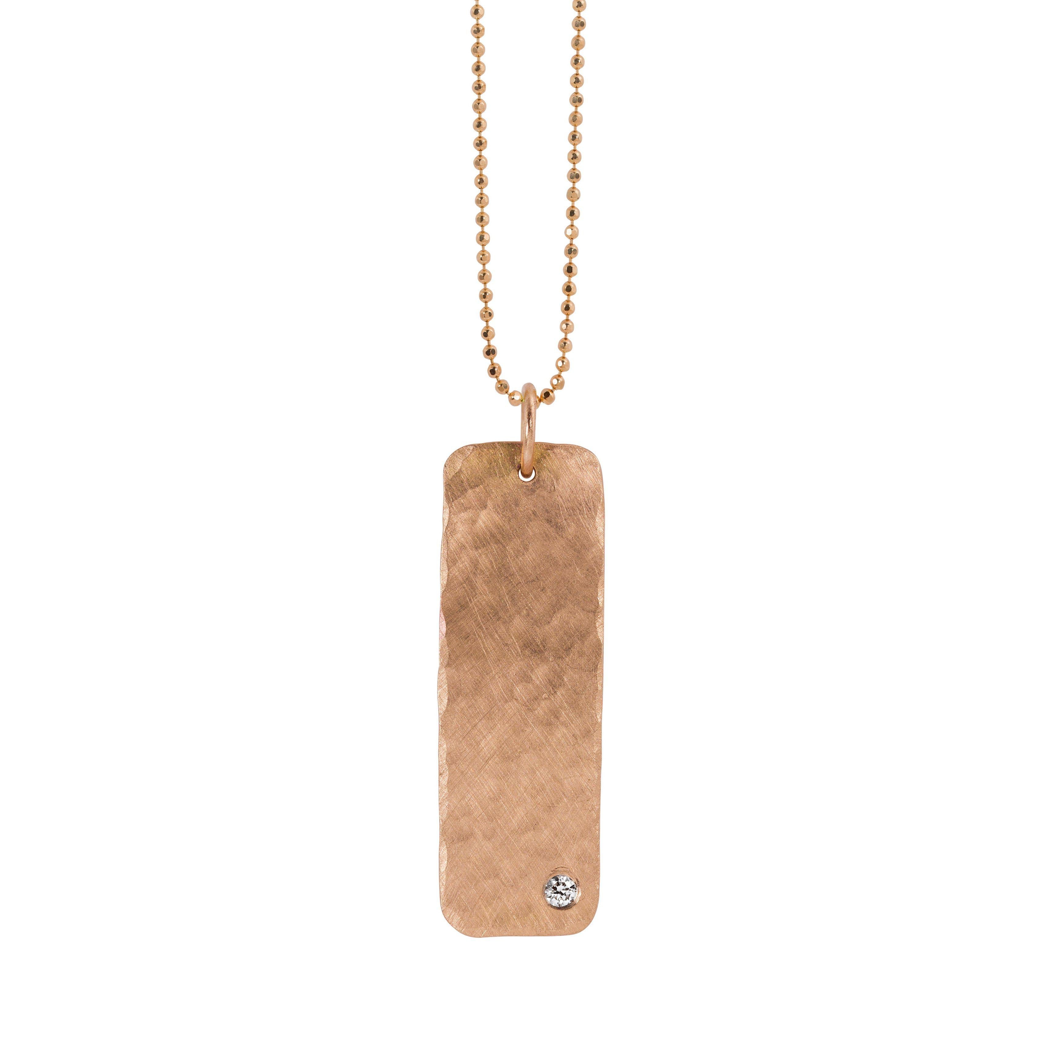 14k rose gold elongated rectanglular hammer texture pendant with single stone diamond accent hanging from dainty ball chain 