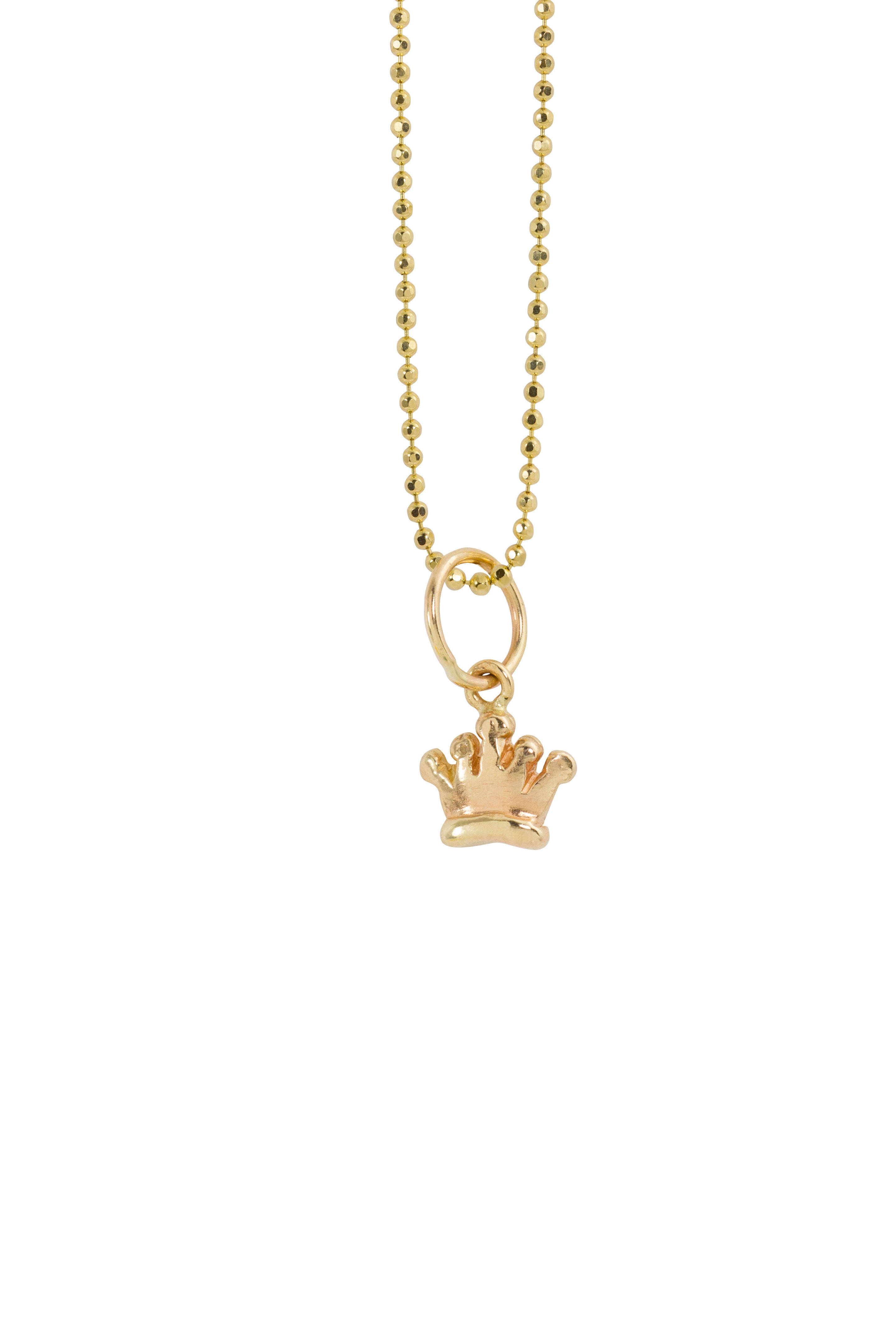 Image of a tiny star shaped drop pendant on chain in 14k yellow gold on a white background.