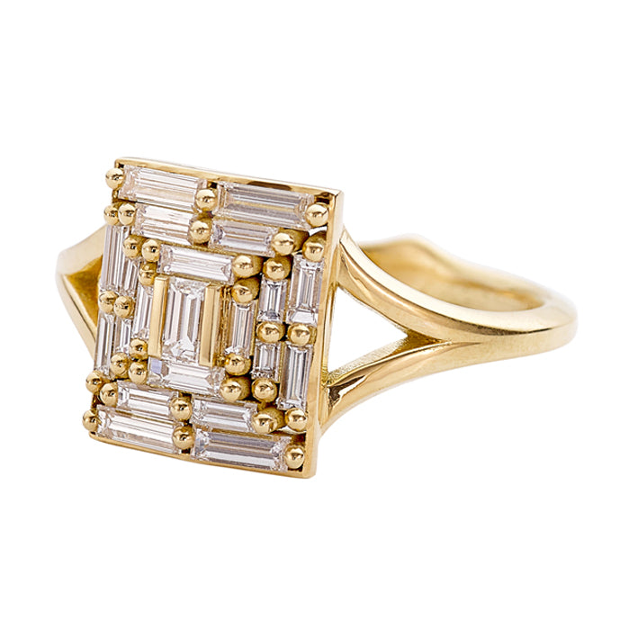 Gold ring with diamond accents on a white background