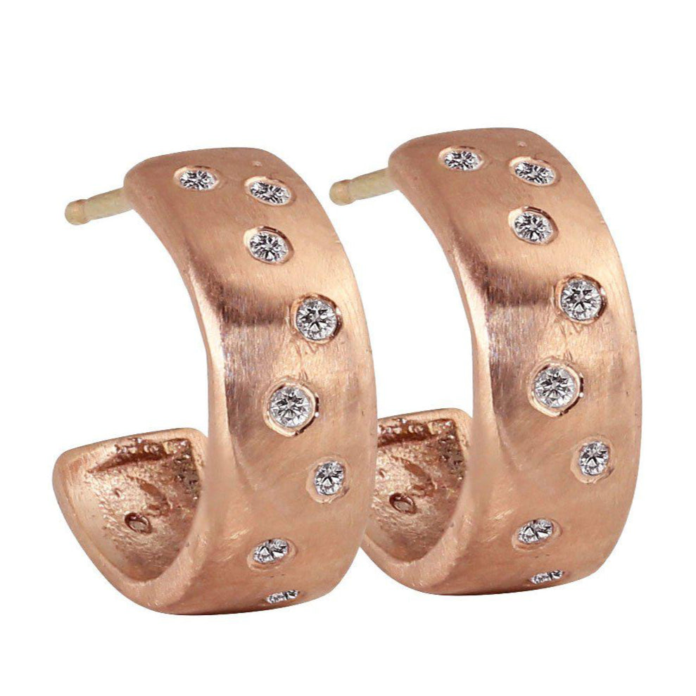 14k rose gold huggie hoop earrings with scattered diamonds brushed satin finish on a white background