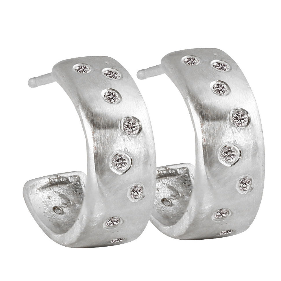 14k white gold huggie hoop earrings with scattered diamonds brushed satin finish on a white background