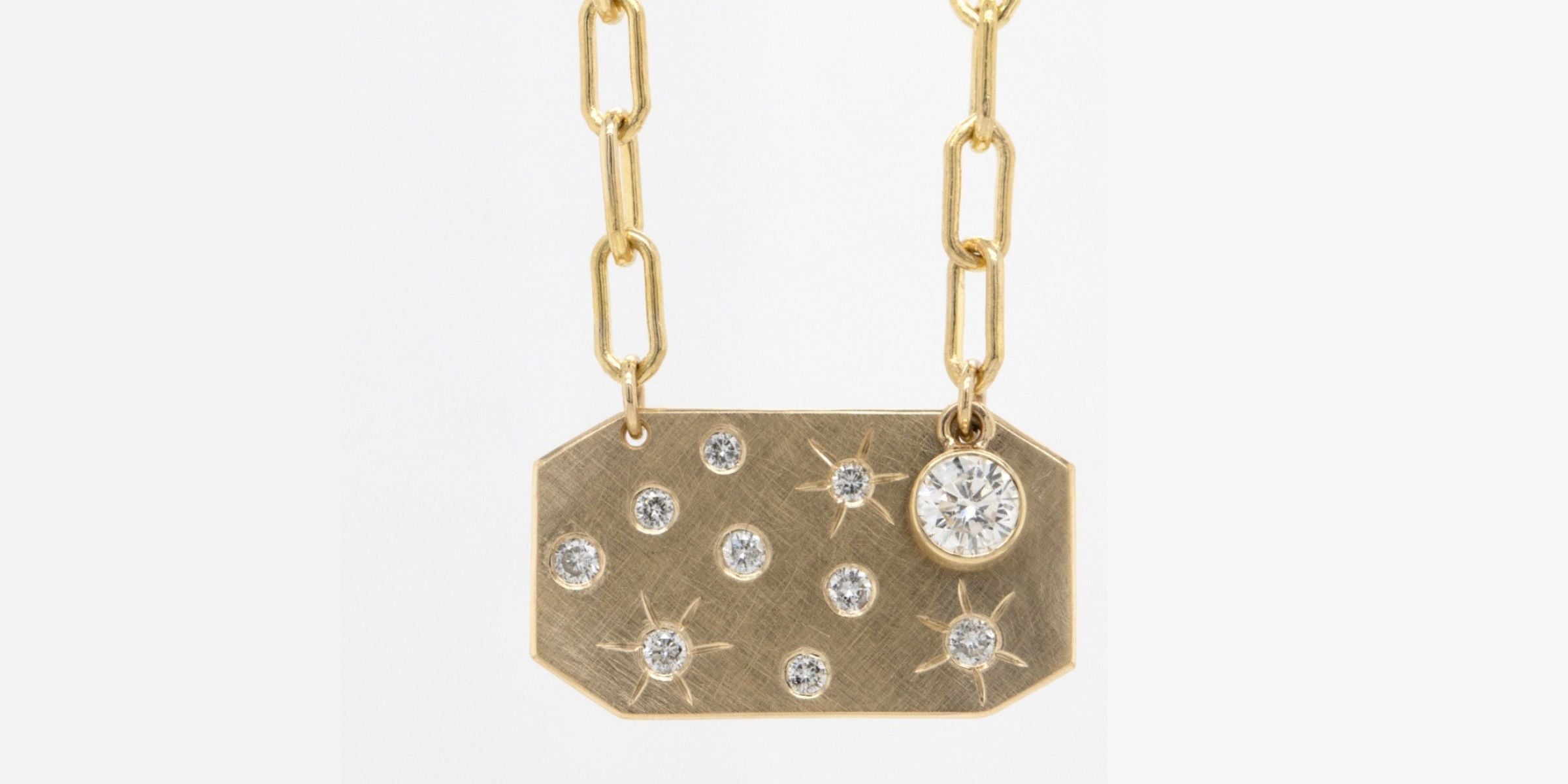 One of a kind pendant necklace with bezel set diamond